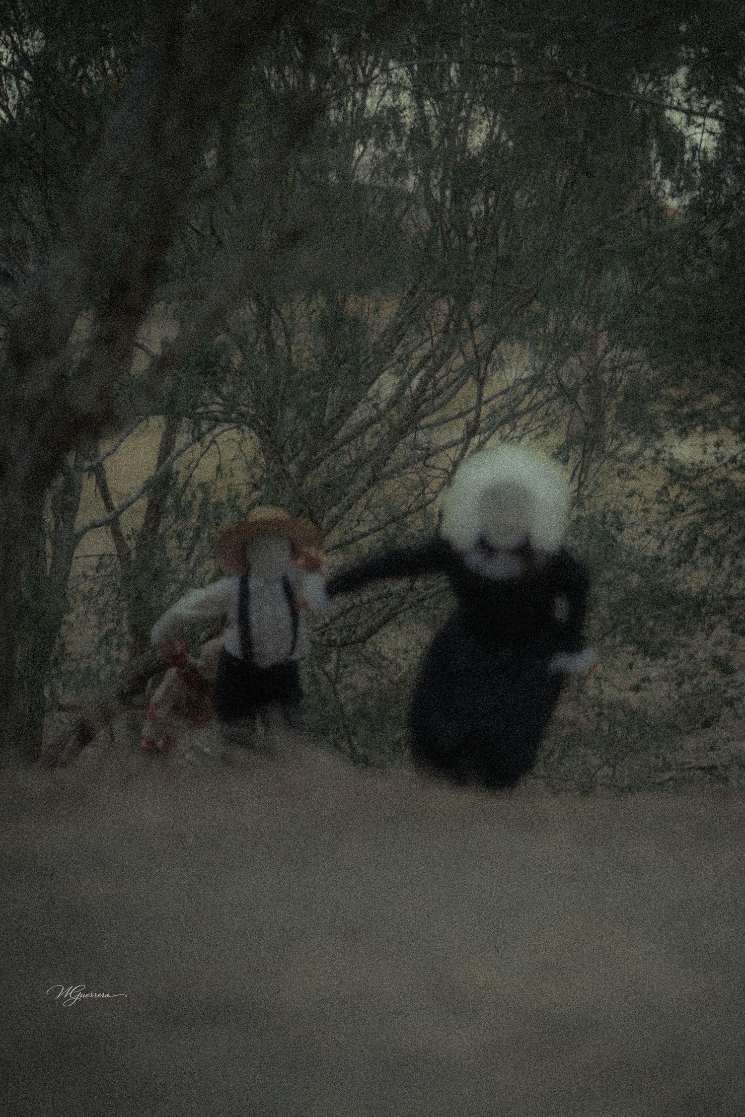 Two blurred figures in vintage clothing hold hands on a dark, moody forest path surrounded by trees.