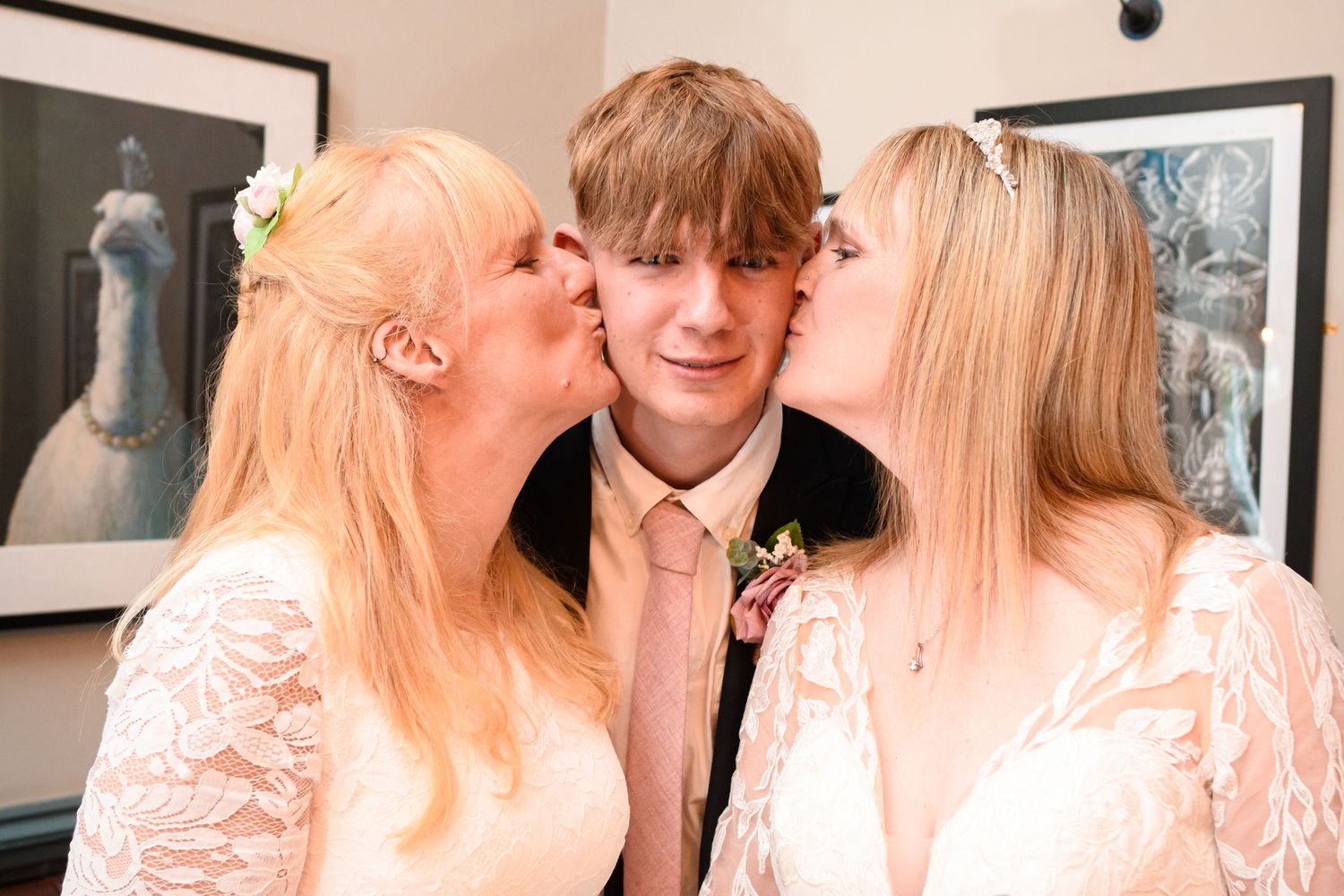 Sweet candid moment between family members at a formal celebration.