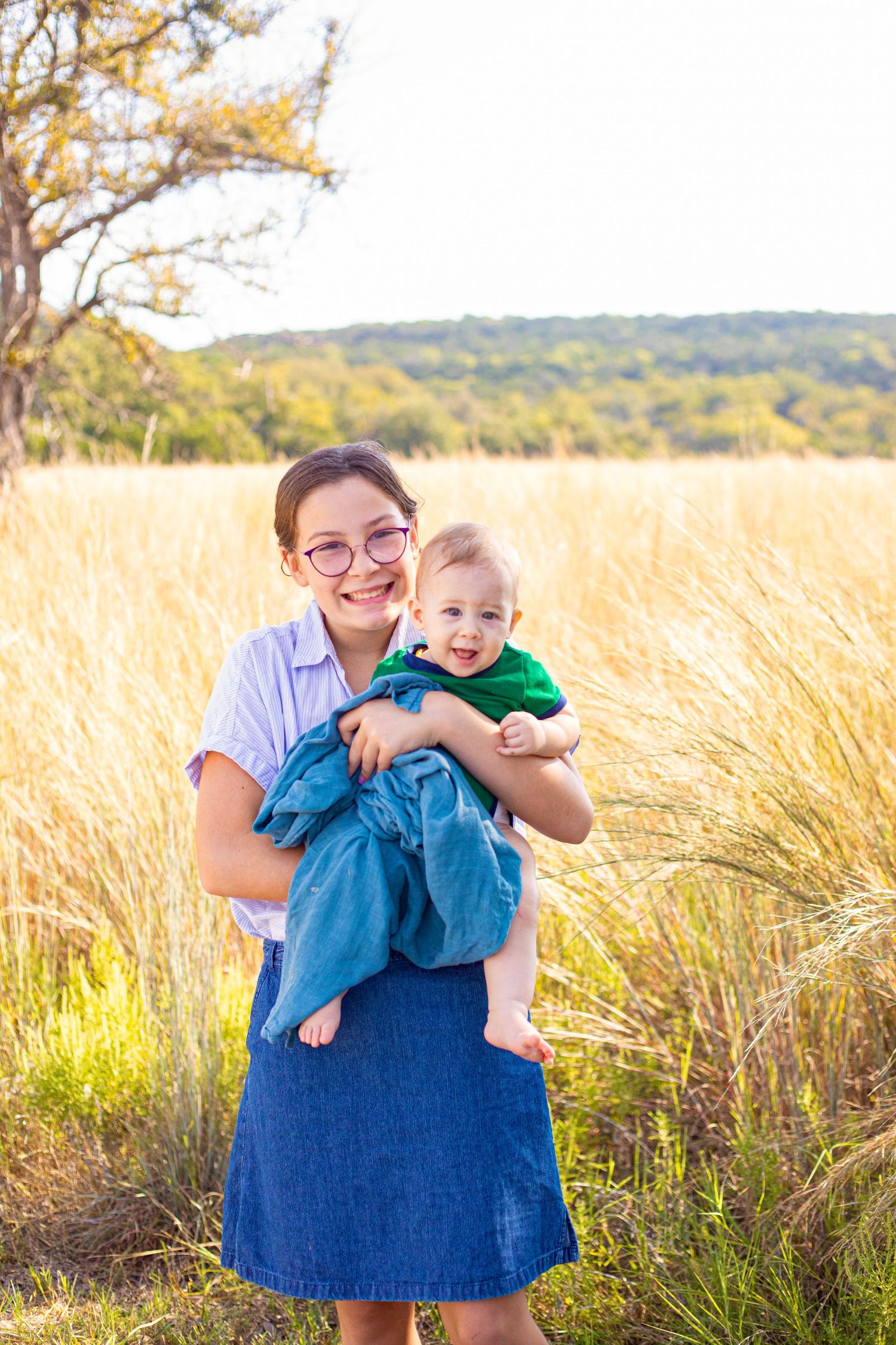 Sweet moment captured in a field of golden grass during sunset.