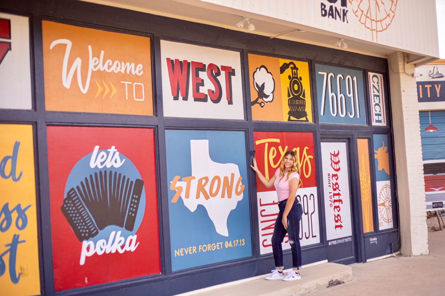 Colorful wall mural featuring various graphic designs and typography with Texas themes in vibrant colors.