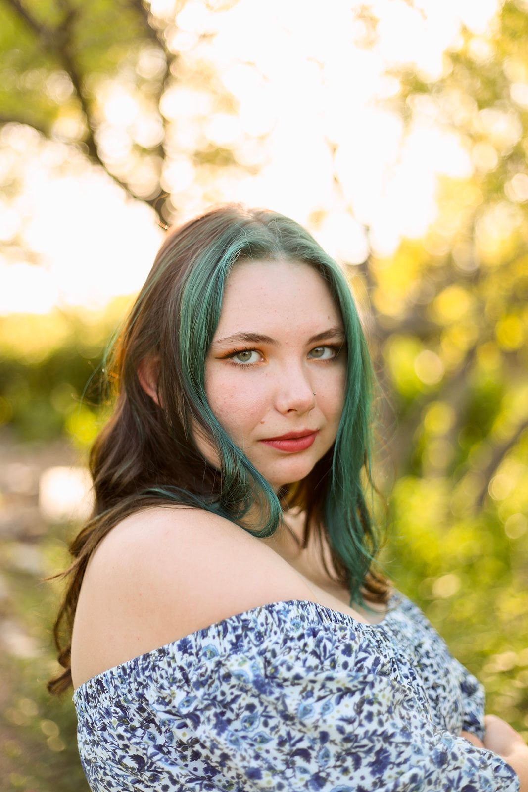 Portrait series in floral off-shoulder dress with golden hour lighting.