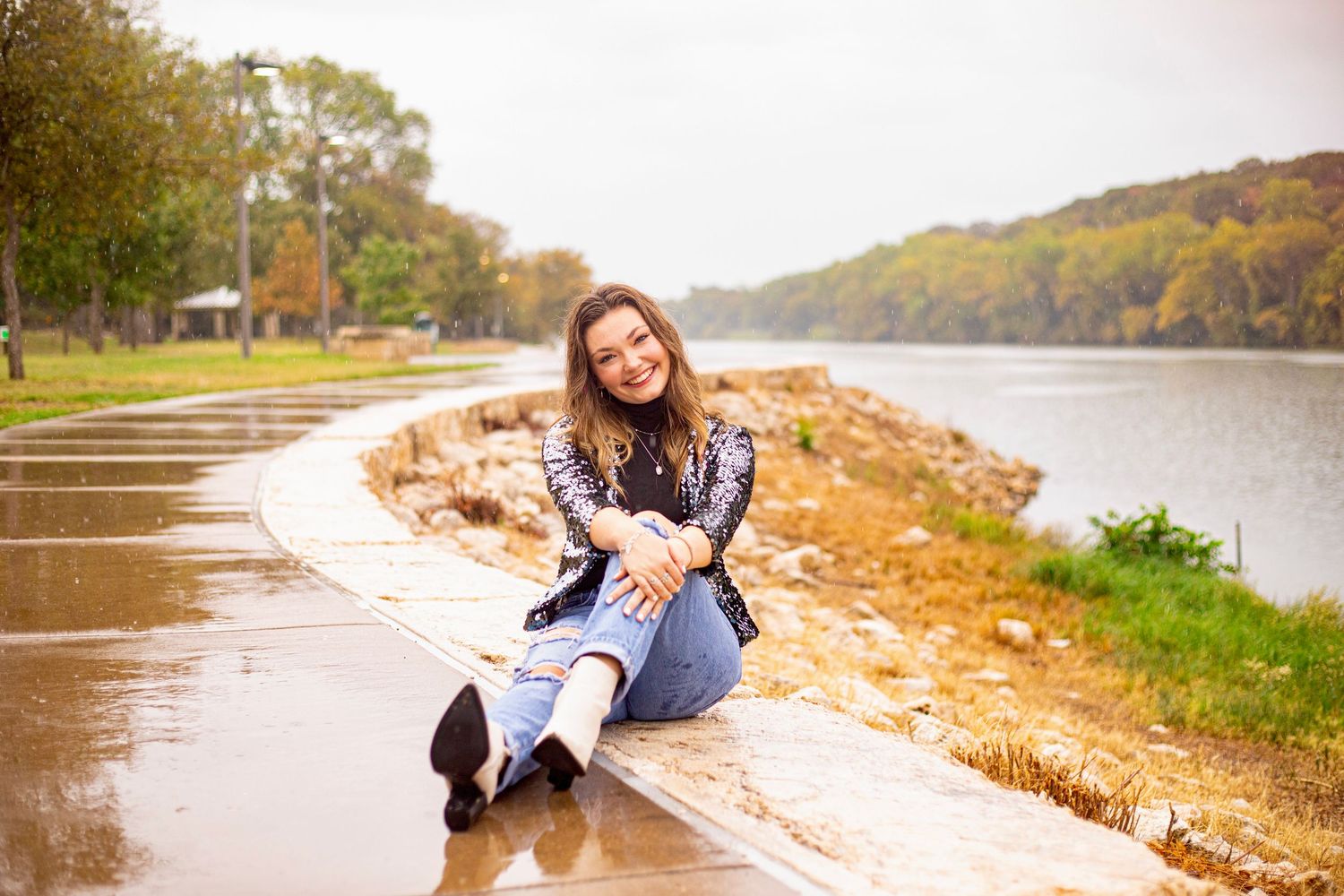 Casual lifestyle photography session along a riverbank in autumn.