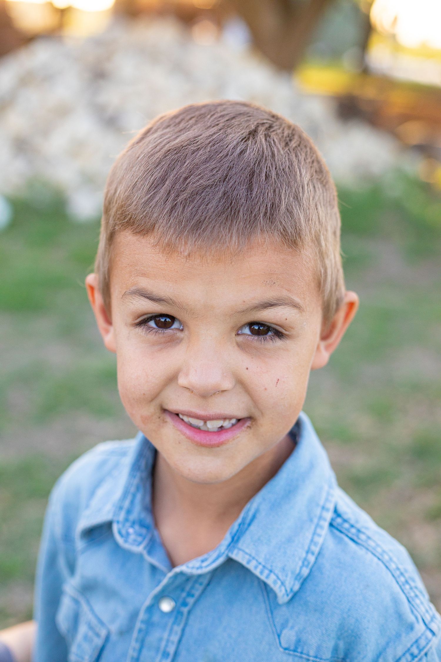 A denim shirt is shown in a series of close-up outdoor portrait shots.