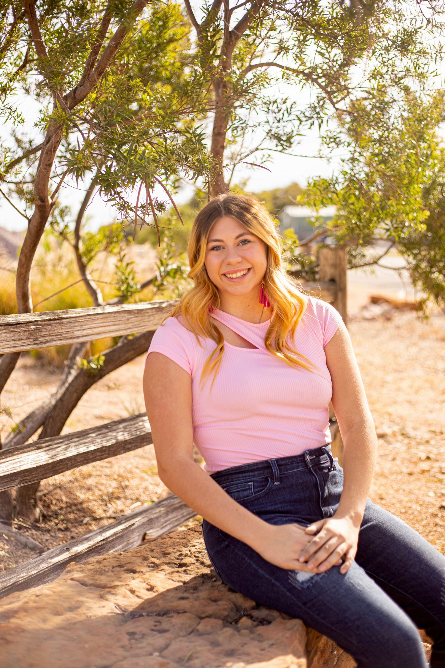 Outdoor portrait series with natural sunlight filtering through trees.