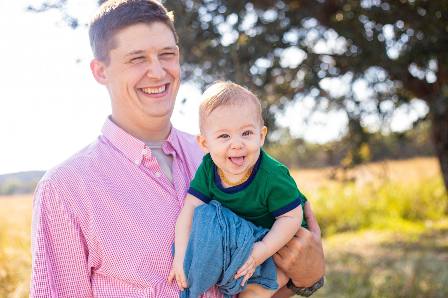 Candid family moments photographed in golden sunlight with natural outdoor setting.