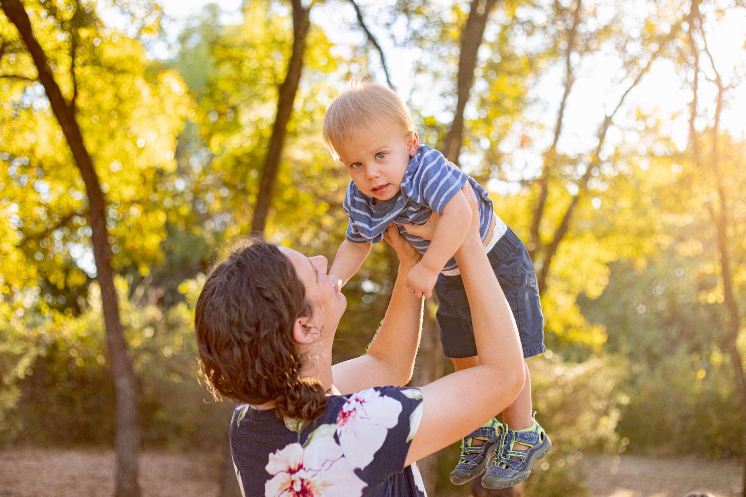 Candid family moments captured in a series of photos in autumn forest setting.