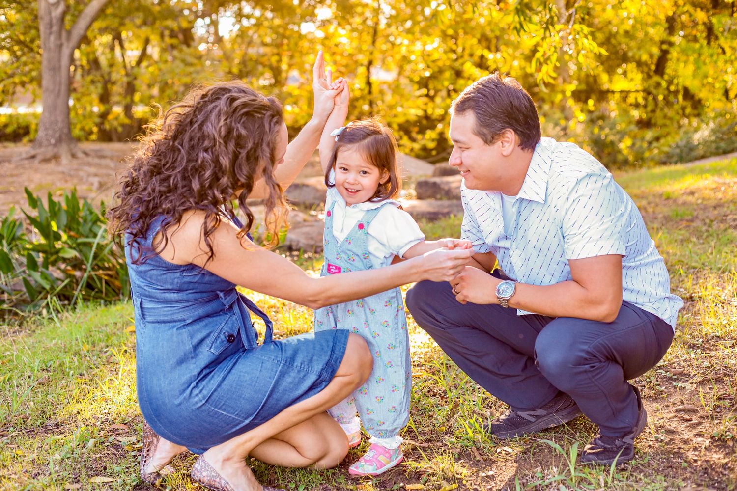 A family photo session captured in golden sunset light showing joyful moments in an outdoor setting.
