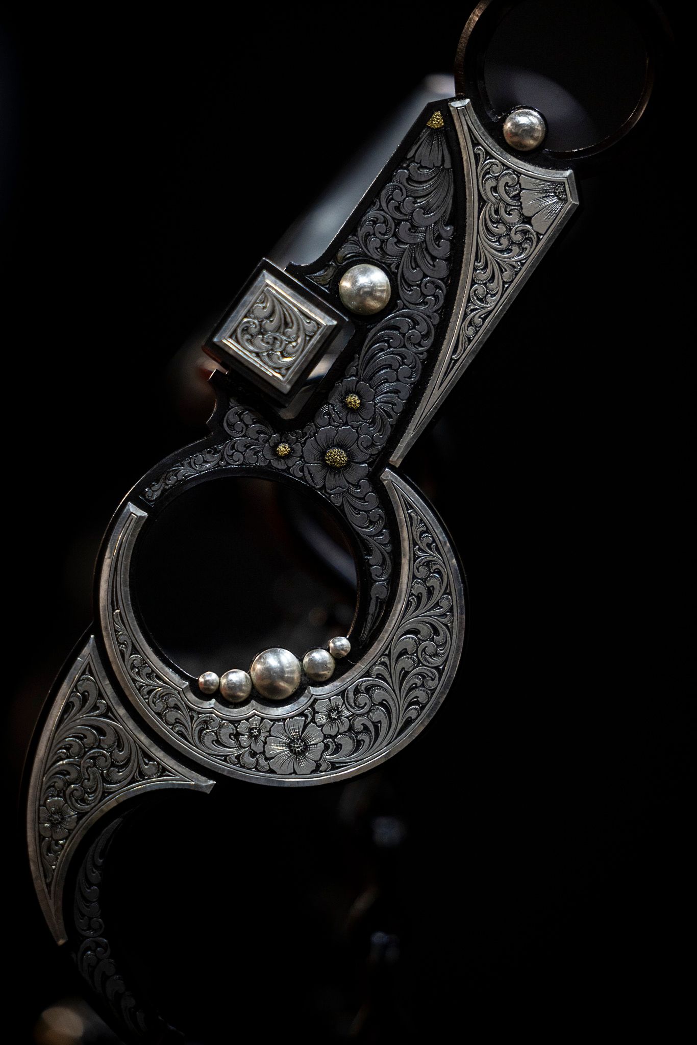 Handmade bit displayed on dark background.