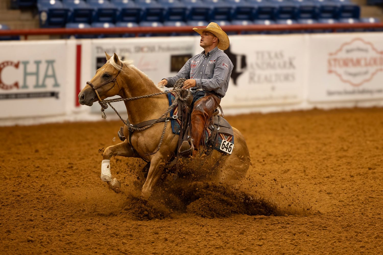 SJR Shiney Believer and Luke Hammerness performing a sliding stop at a horse show