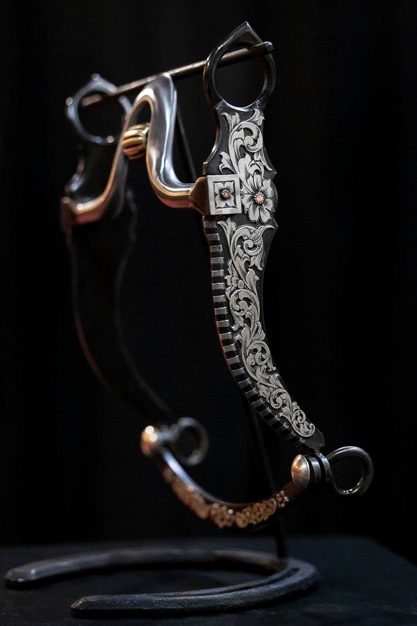 Handmade bit displayed on dark background.