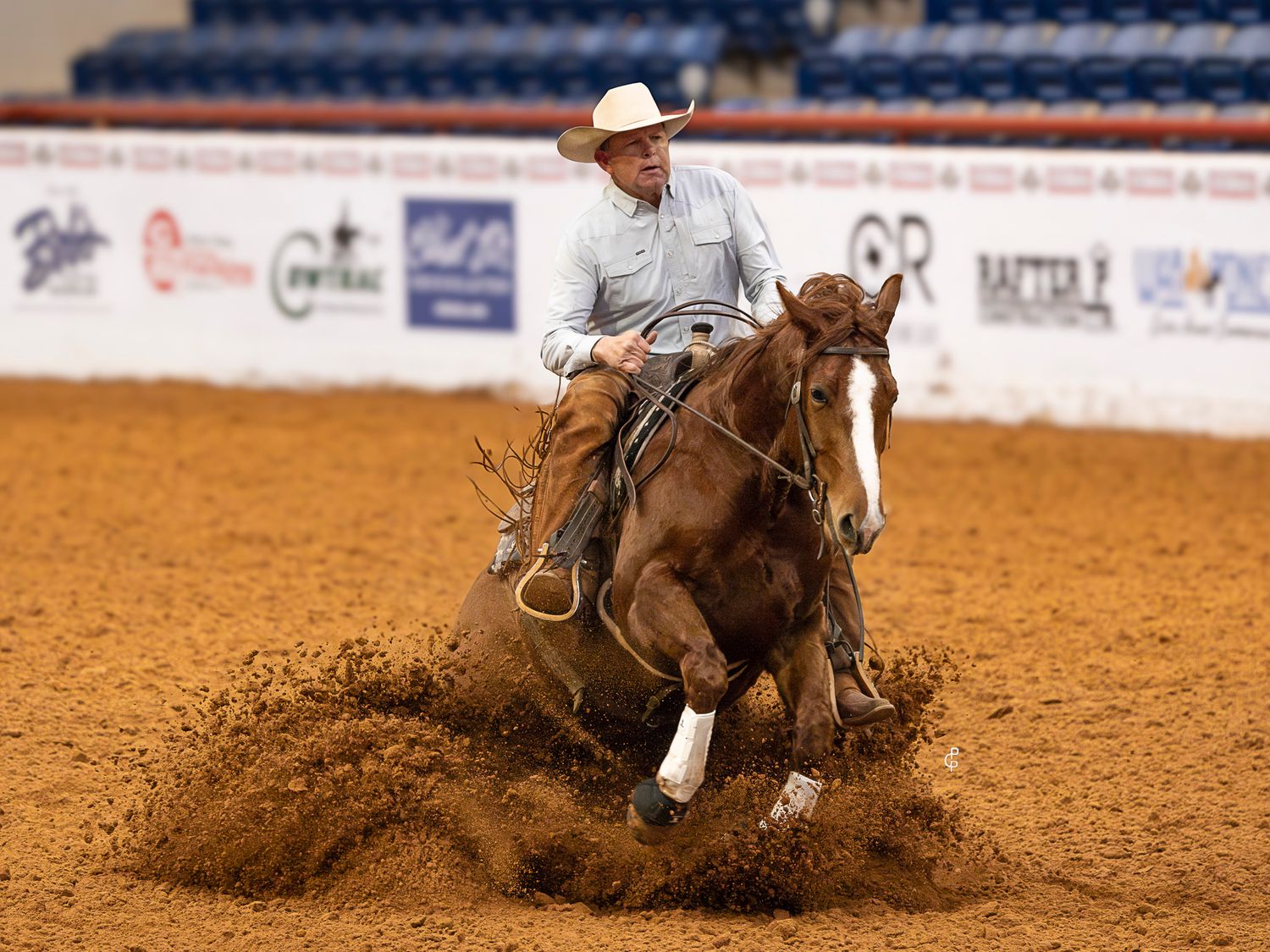sorrel horse doing a sliding stop during the snaffle bit futurity open prelims