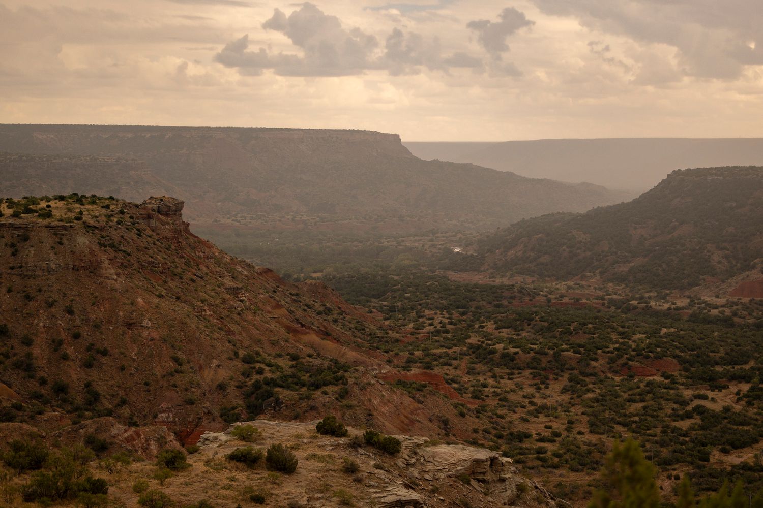 Hazy view of Palo Duro Canyon as a thunderstorm is rolling in