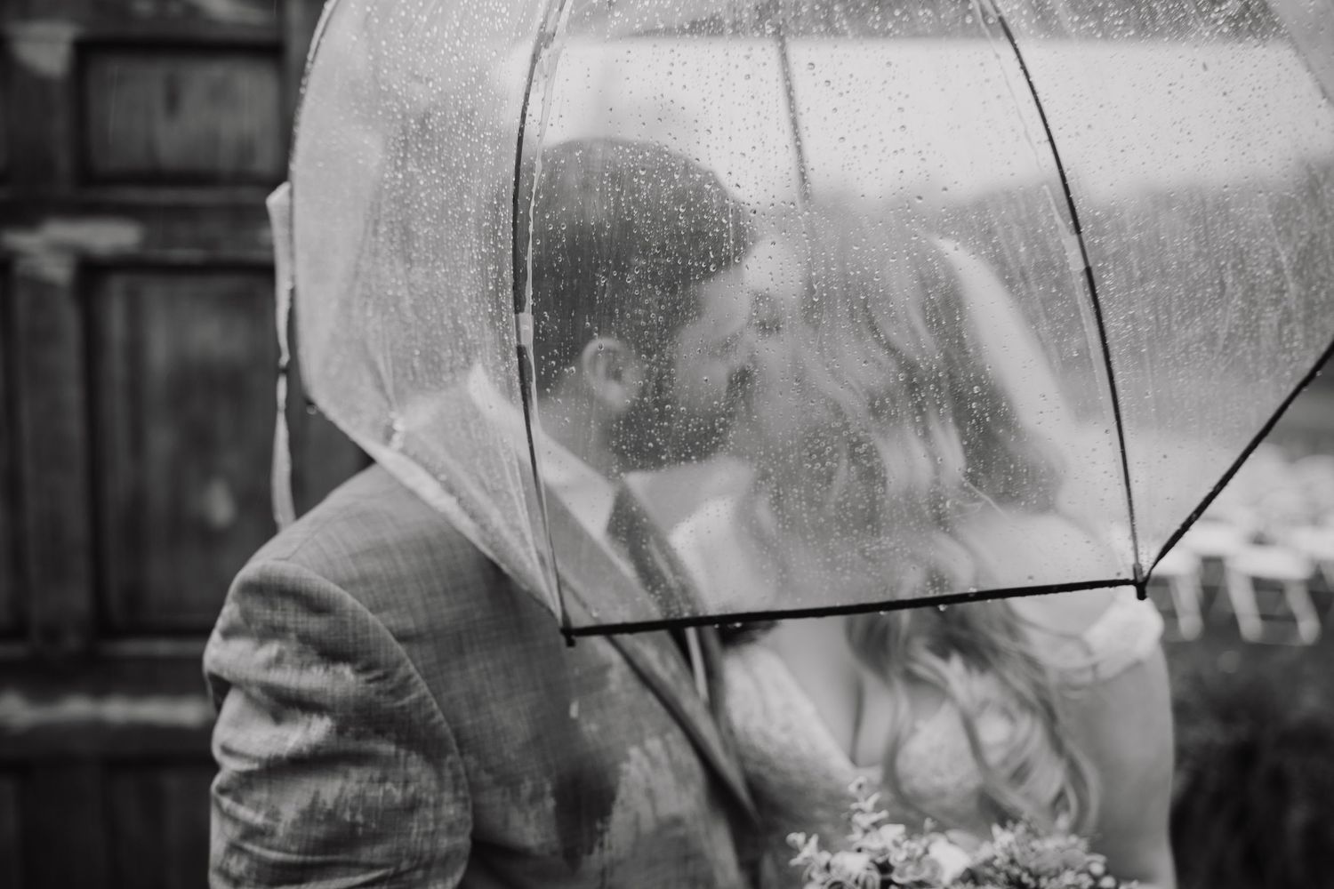 Black and white romantic umbrella shots in the rain.