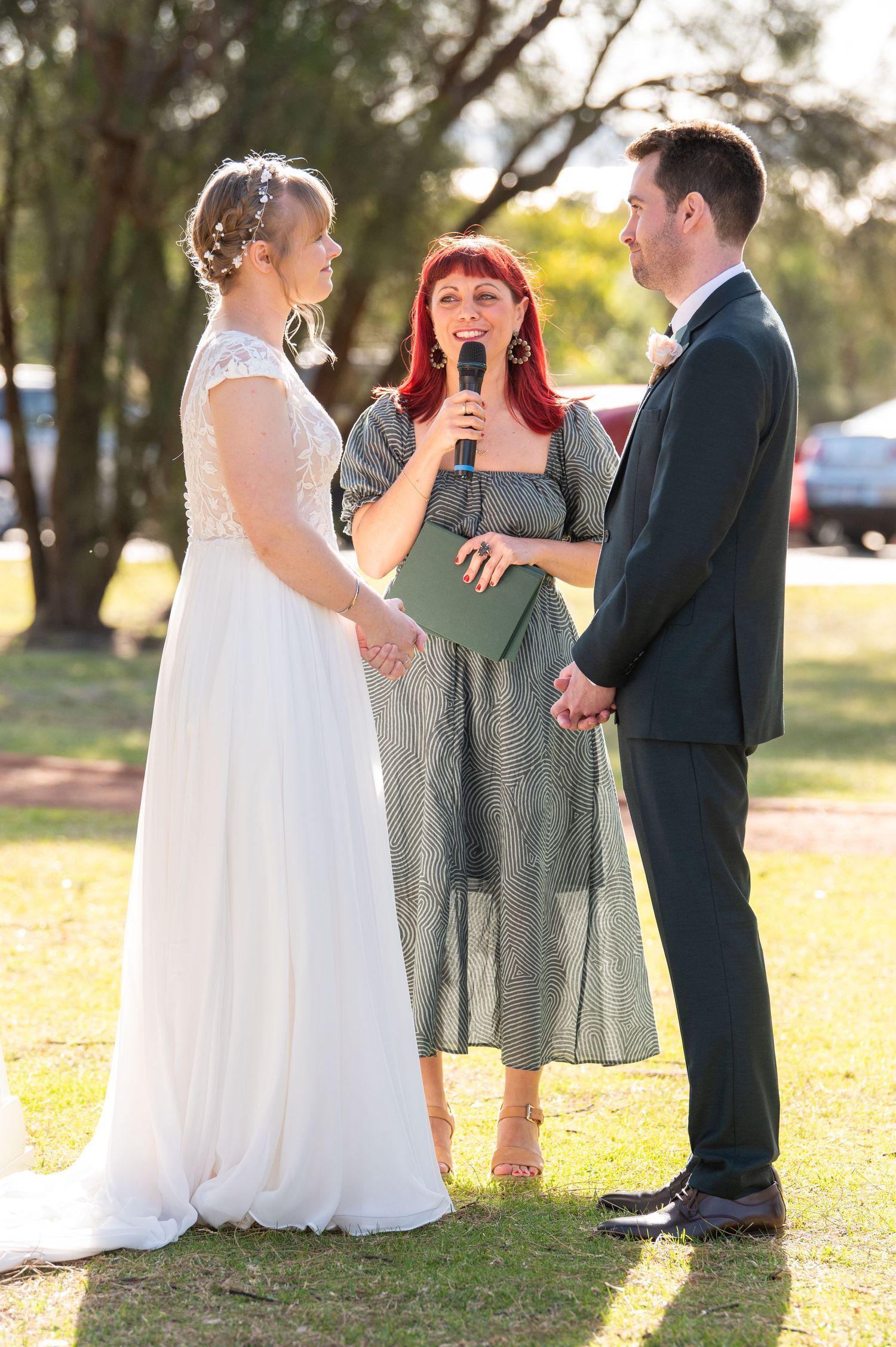 A wedding ceremony is captured in a series of candid outdoor moments at sunset with the couple and officiant.