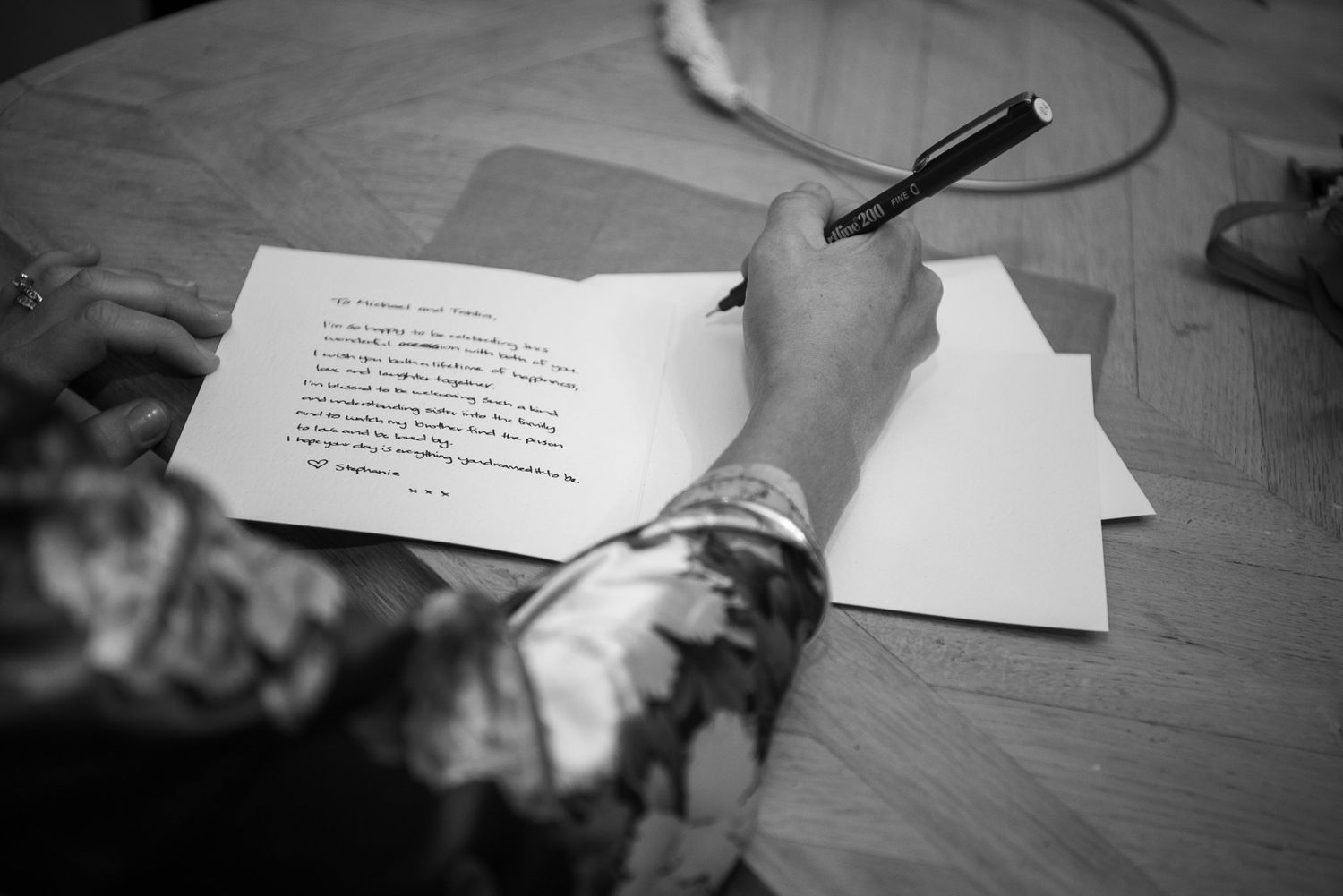 Black and white photography collage showing multiple documents or papers arranged in different angles.
