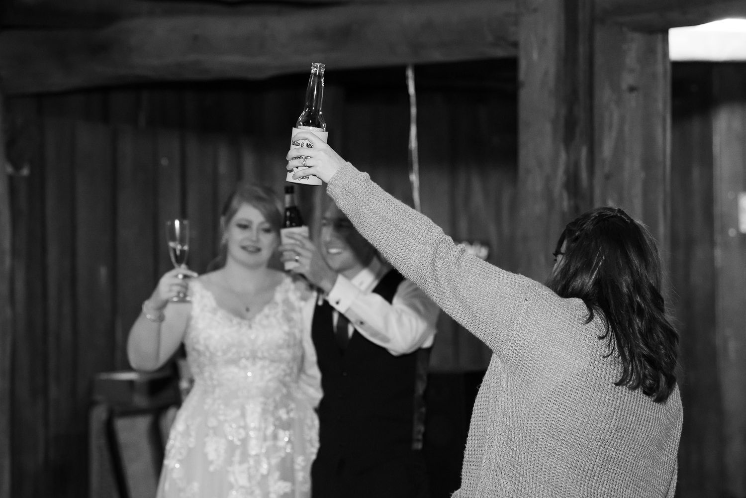 Wedding couple dancing together at their reception in various shots shown in black and white film strip style.