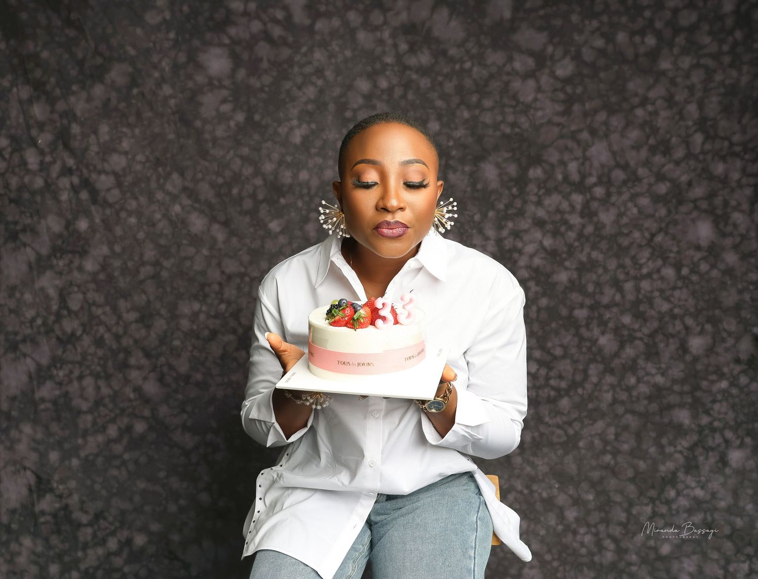 Candid portrait series showing joyful expressions in white shirt and gray pants.