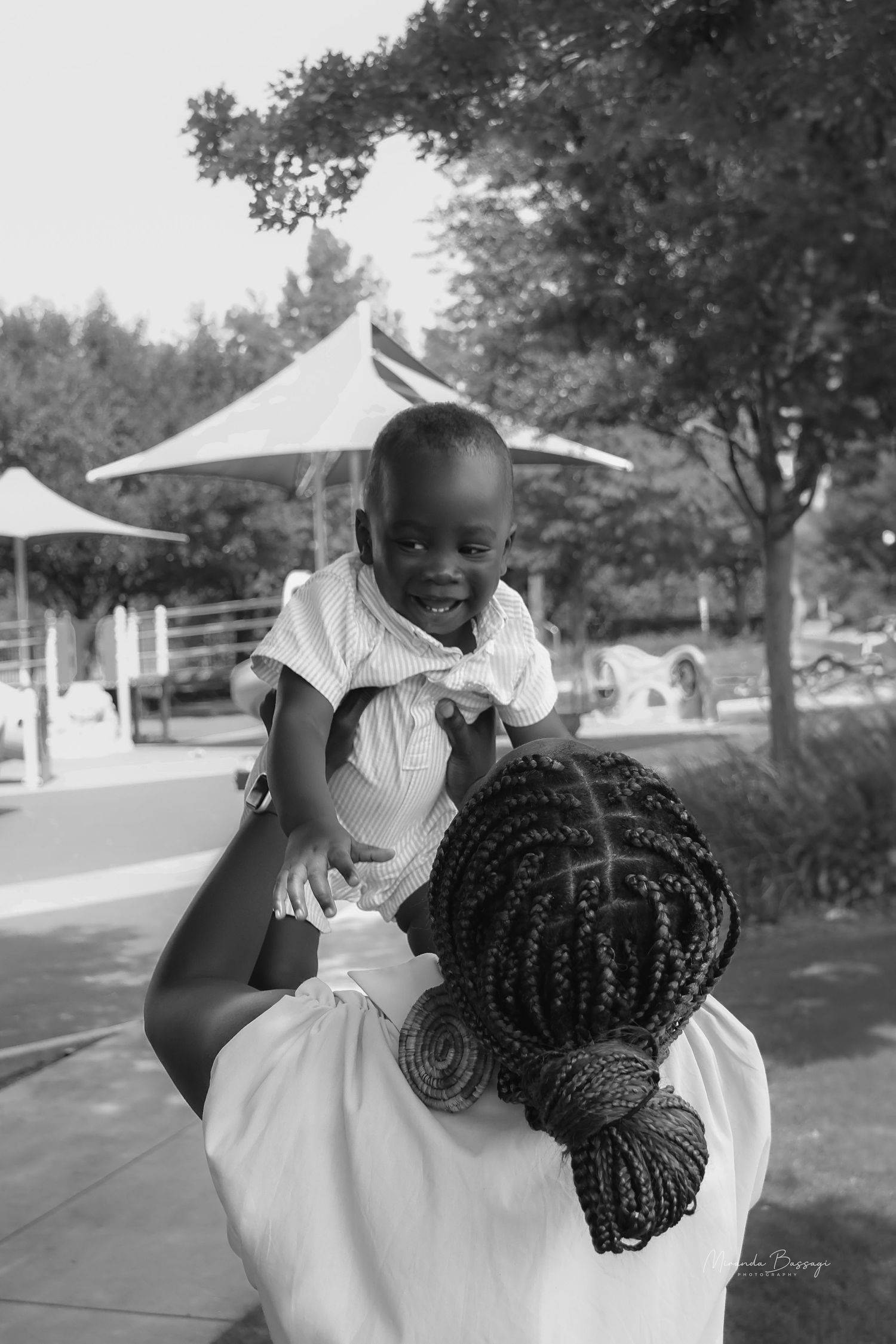 Outdoor photoshoot capturing playful spinning moments in white dresses.