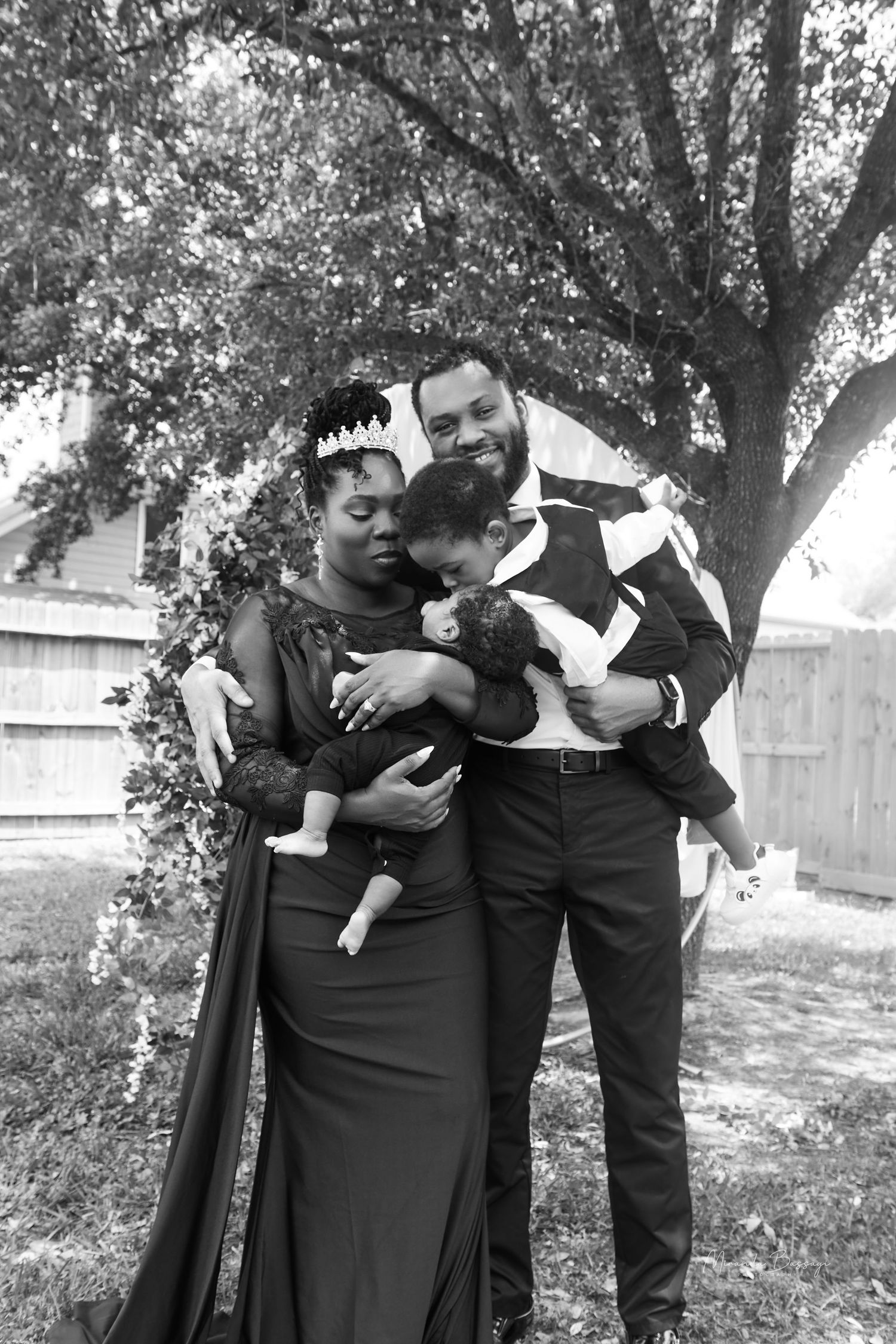 Black and white portraits of group in formal wear showing playful interactions outdoors.