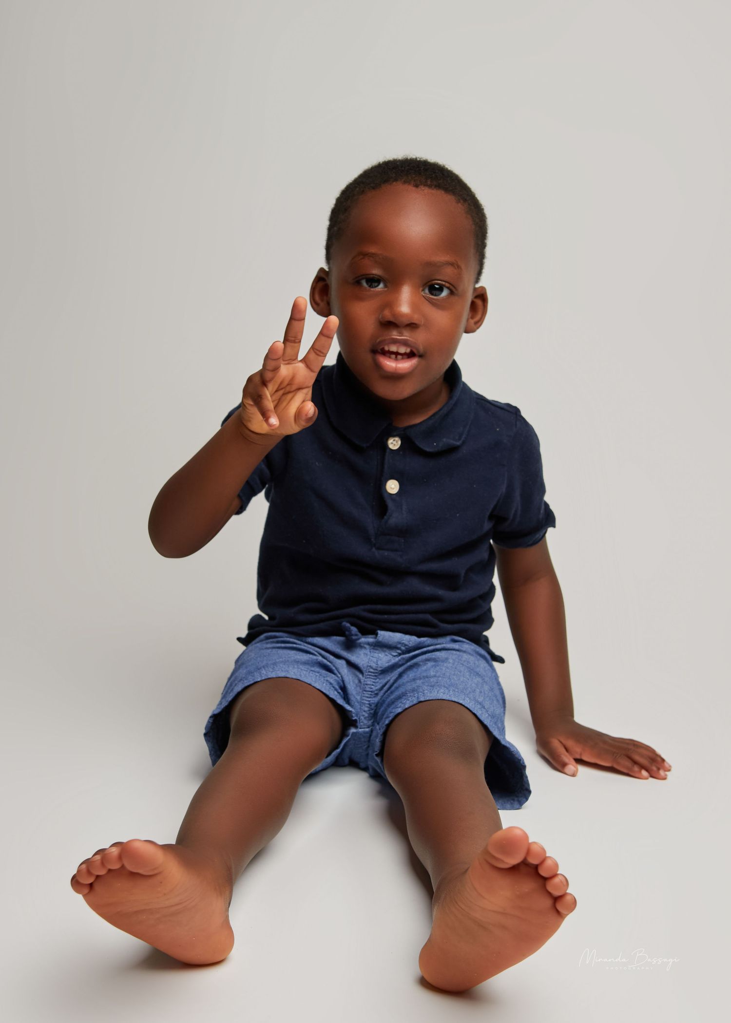 Studio photography sequence showing energetic child poses and expressions.