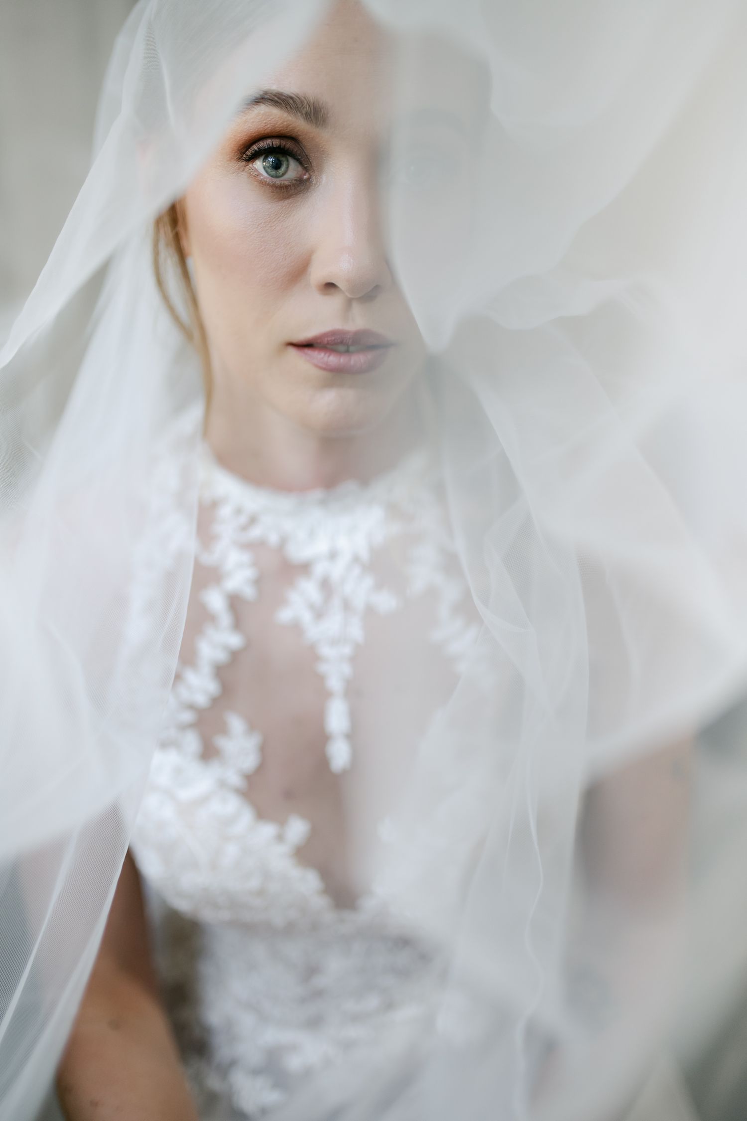 Close-up shot of a delicate bridal veil with lace detailing.