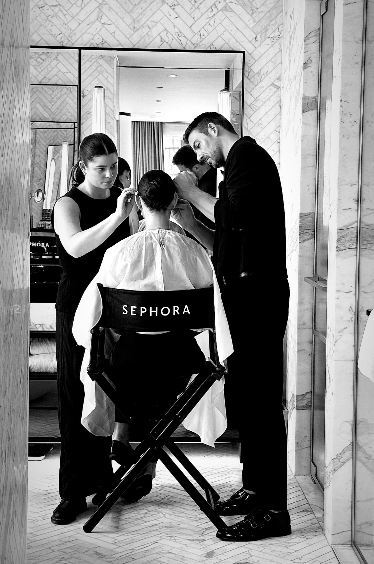 Black and white photos of Sephora store interior with director chairs and staff.
