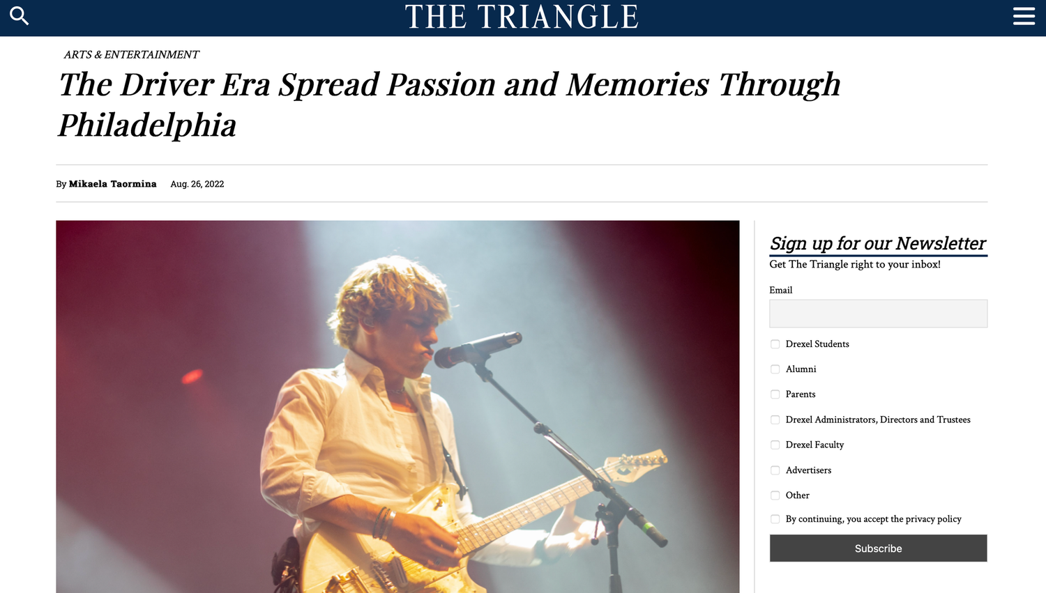 The Triangle article about The Driver Era concert in Philadelphia with performer on stage holding guitar.