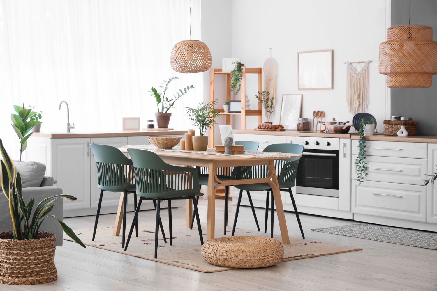 Modern Scandinavian living room interior with white walls, natural wood furniture and green plants.