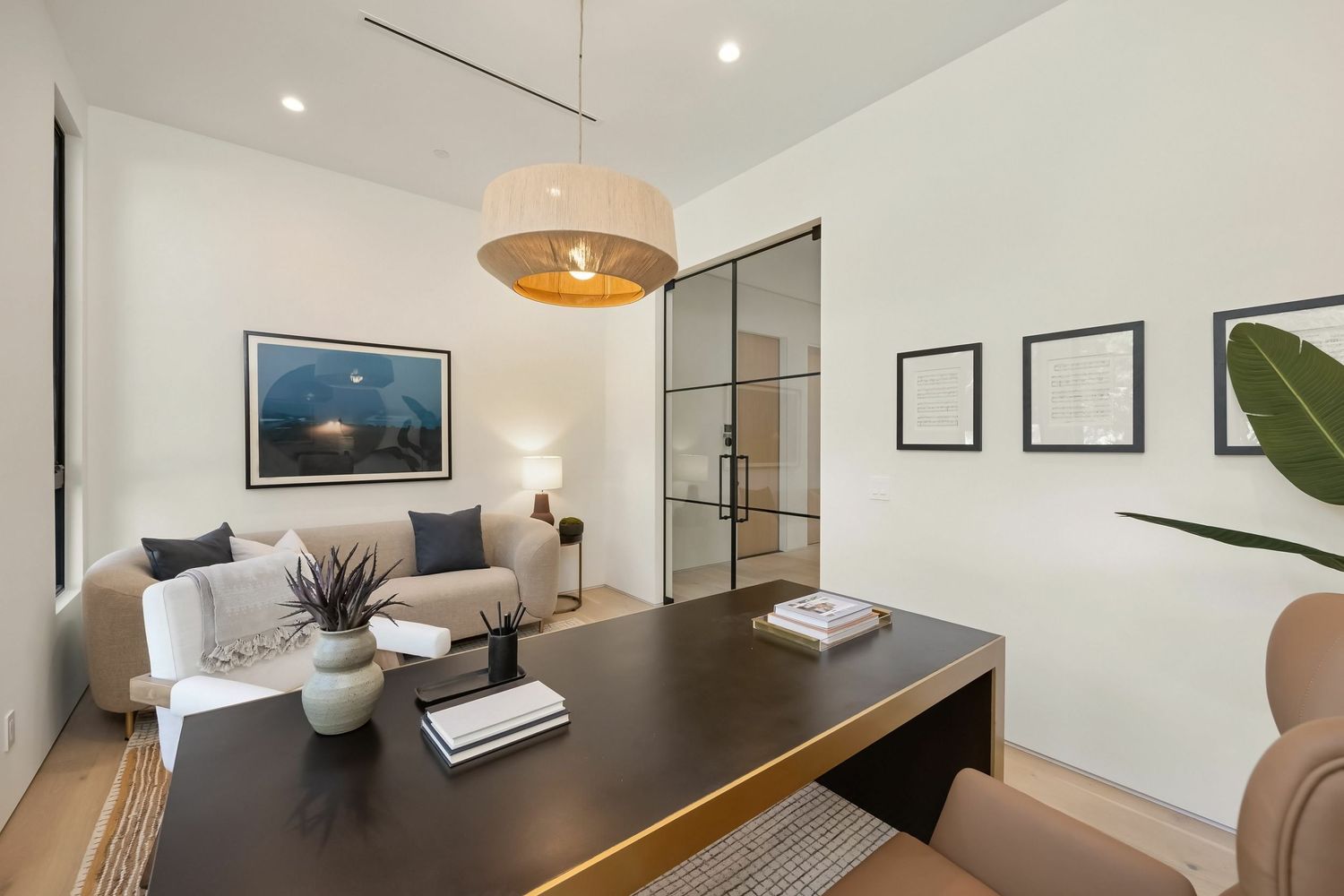 Contemporary living room interior with minimalist decor and natural lighting.
