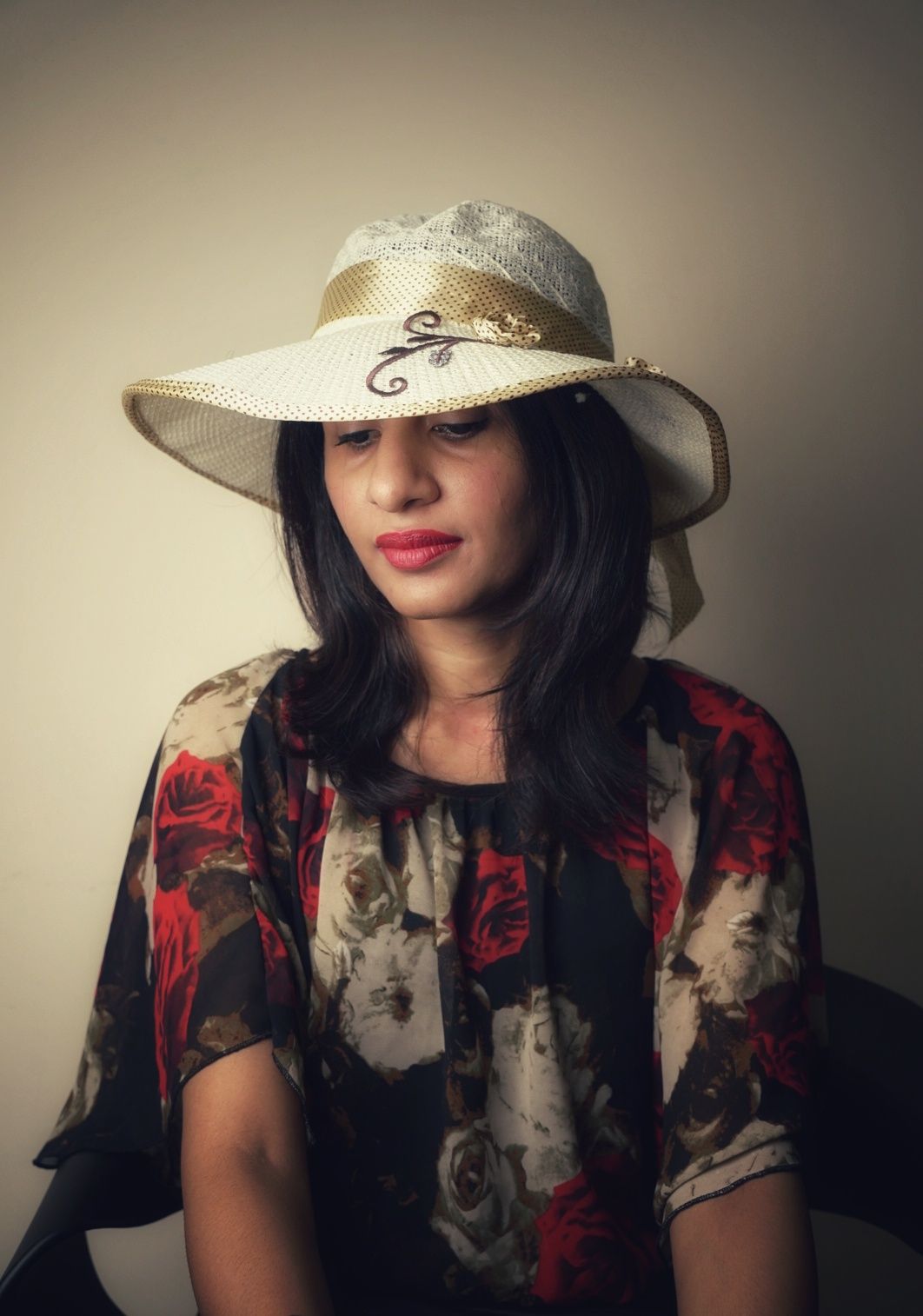 A series of artistic portraits showing a person in a cream sun hat and floral dress against a neutral background.