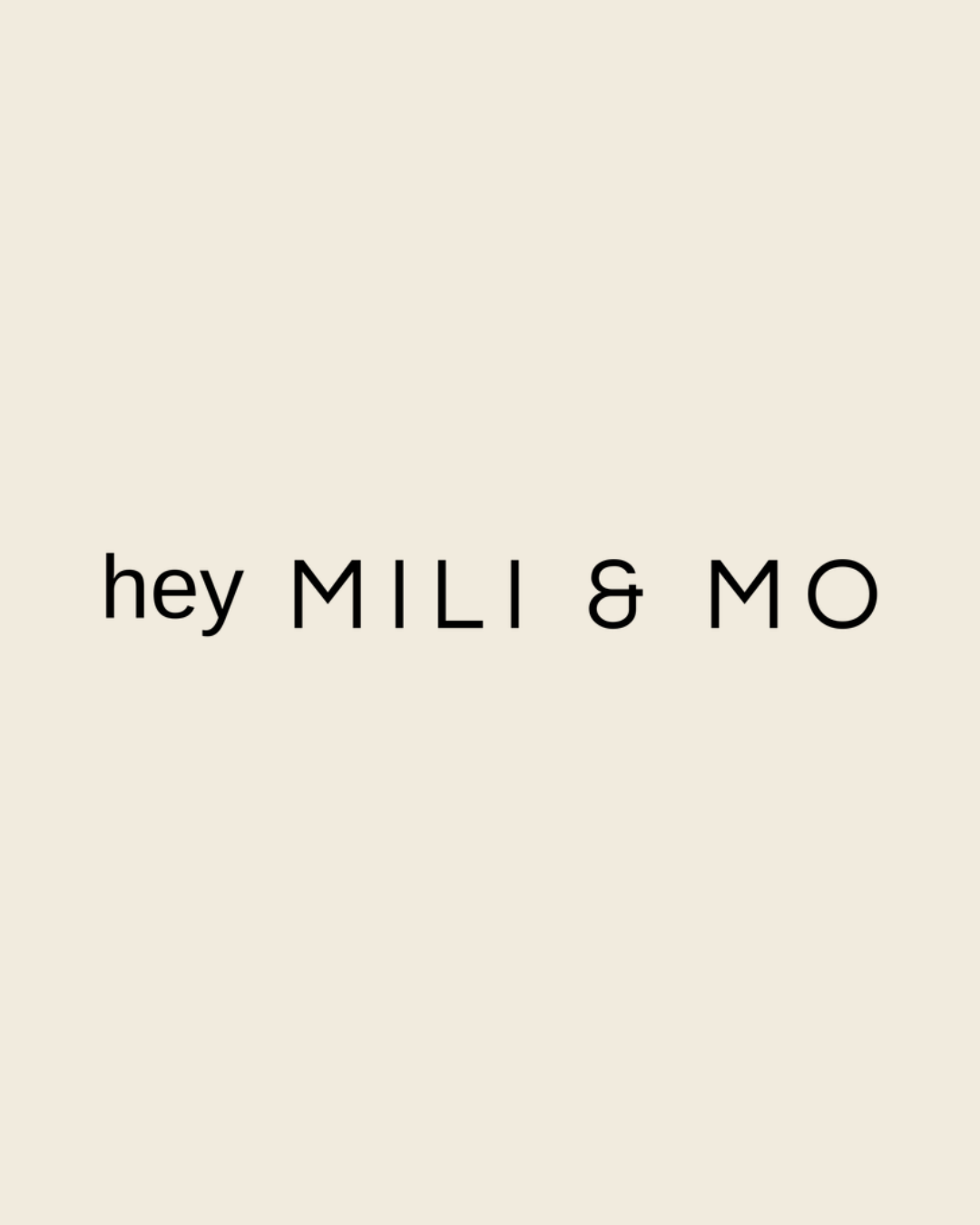 Simple text logo reading 'hey MILI & MO' in black letters on a light beige background.