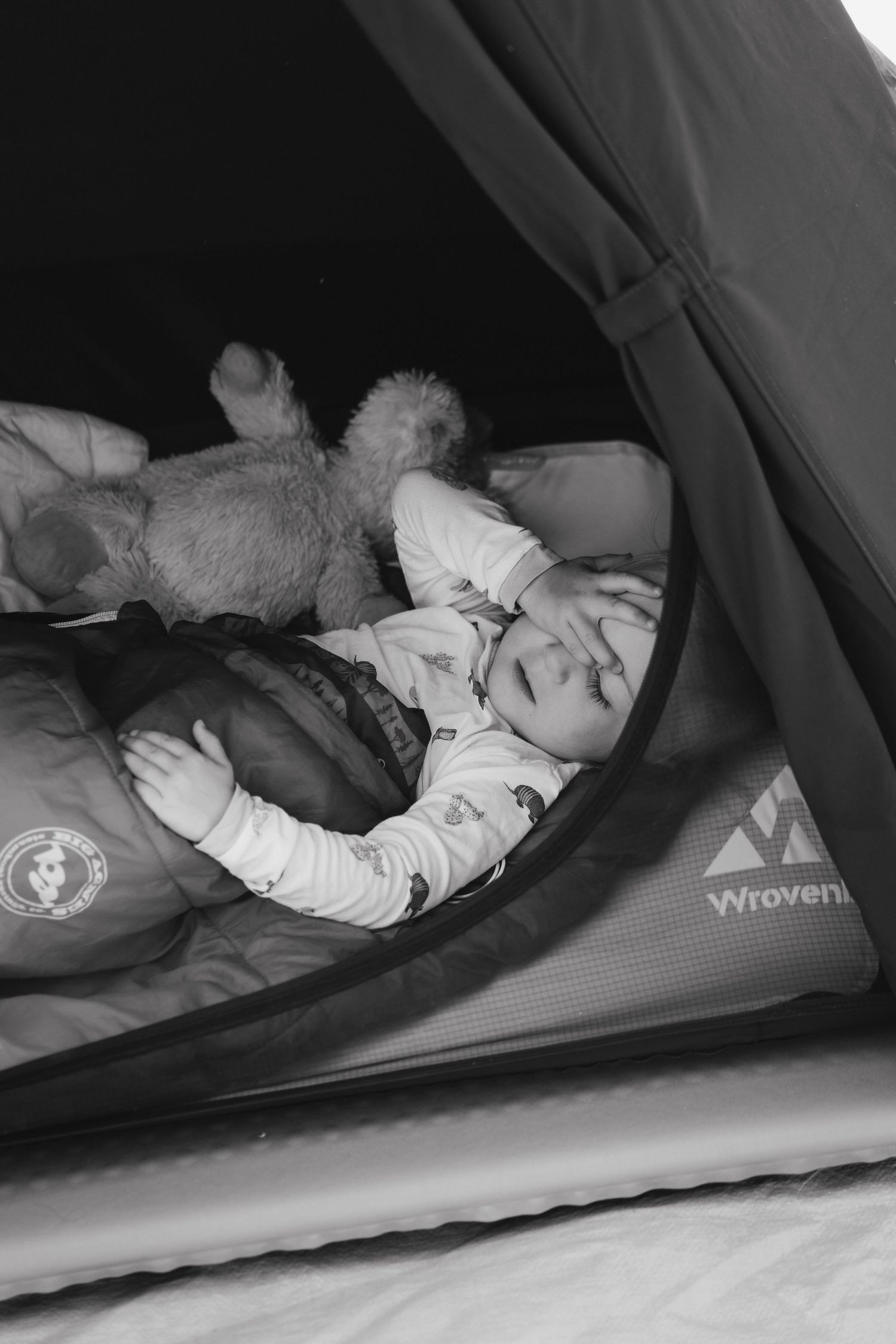 Black and white photo sequence showing someone sleeping peacefully in a camping tent on an inflatable mattress.
