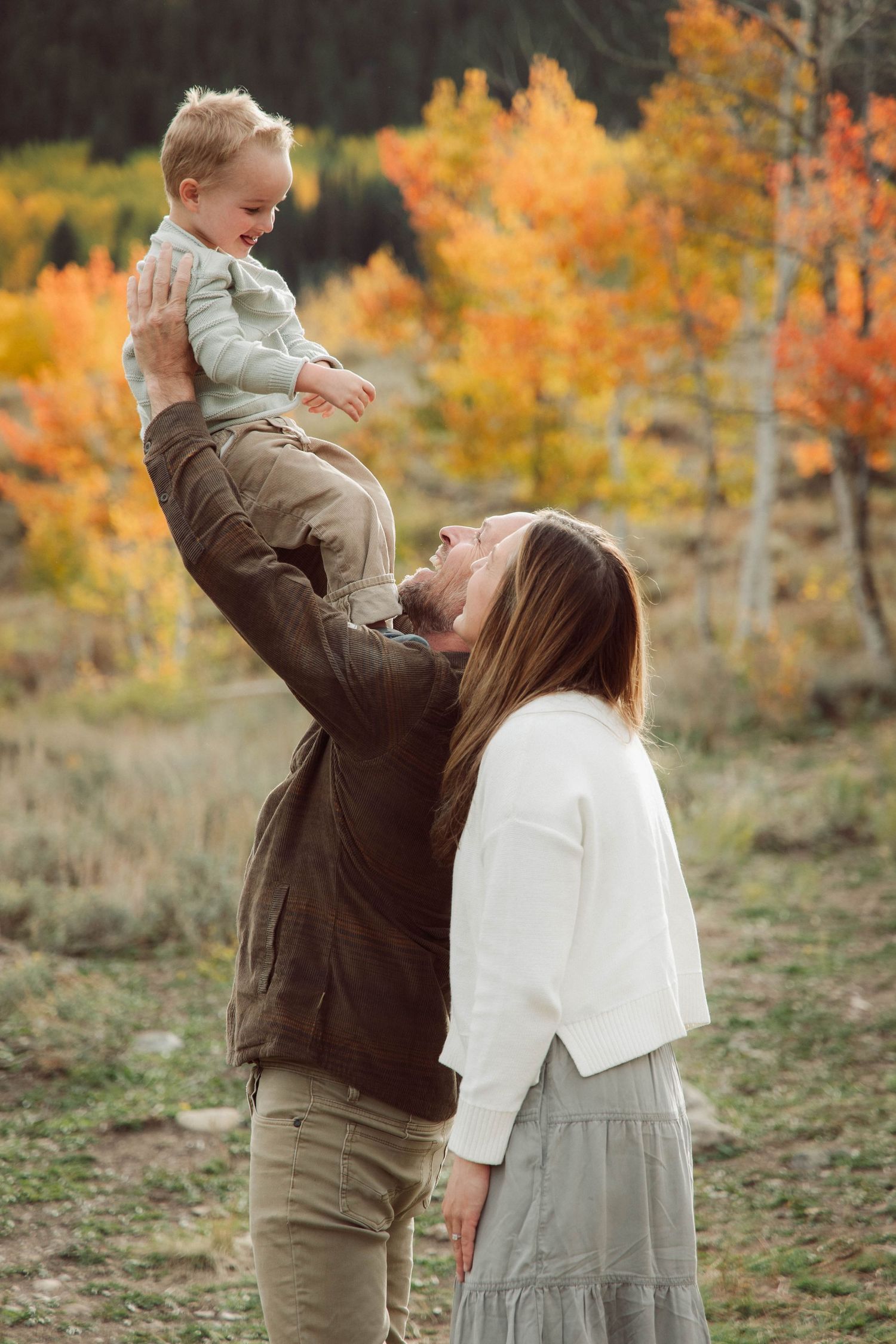 Playful family moments captured in sequence against vibrant fall foliage.