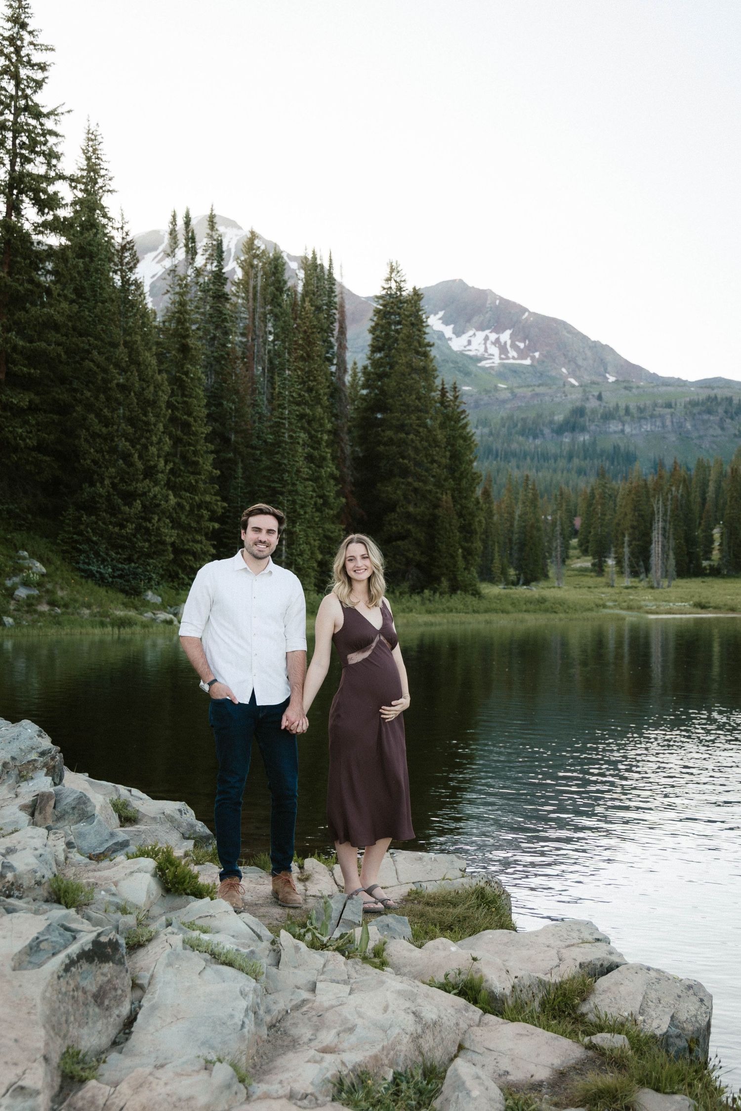 Summer maternity photo with wildflowers crested butte, Colorado Lake Irwin by lake