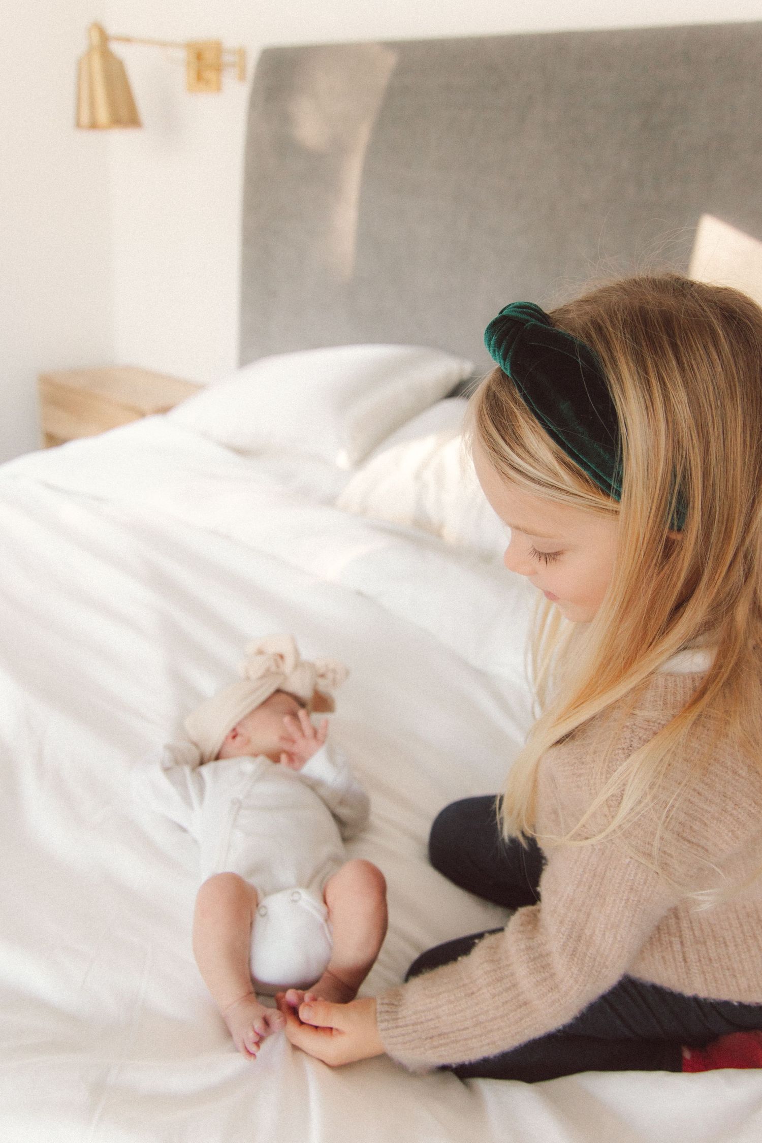 At home newborn photography on bed. Crested Butte, Colorado