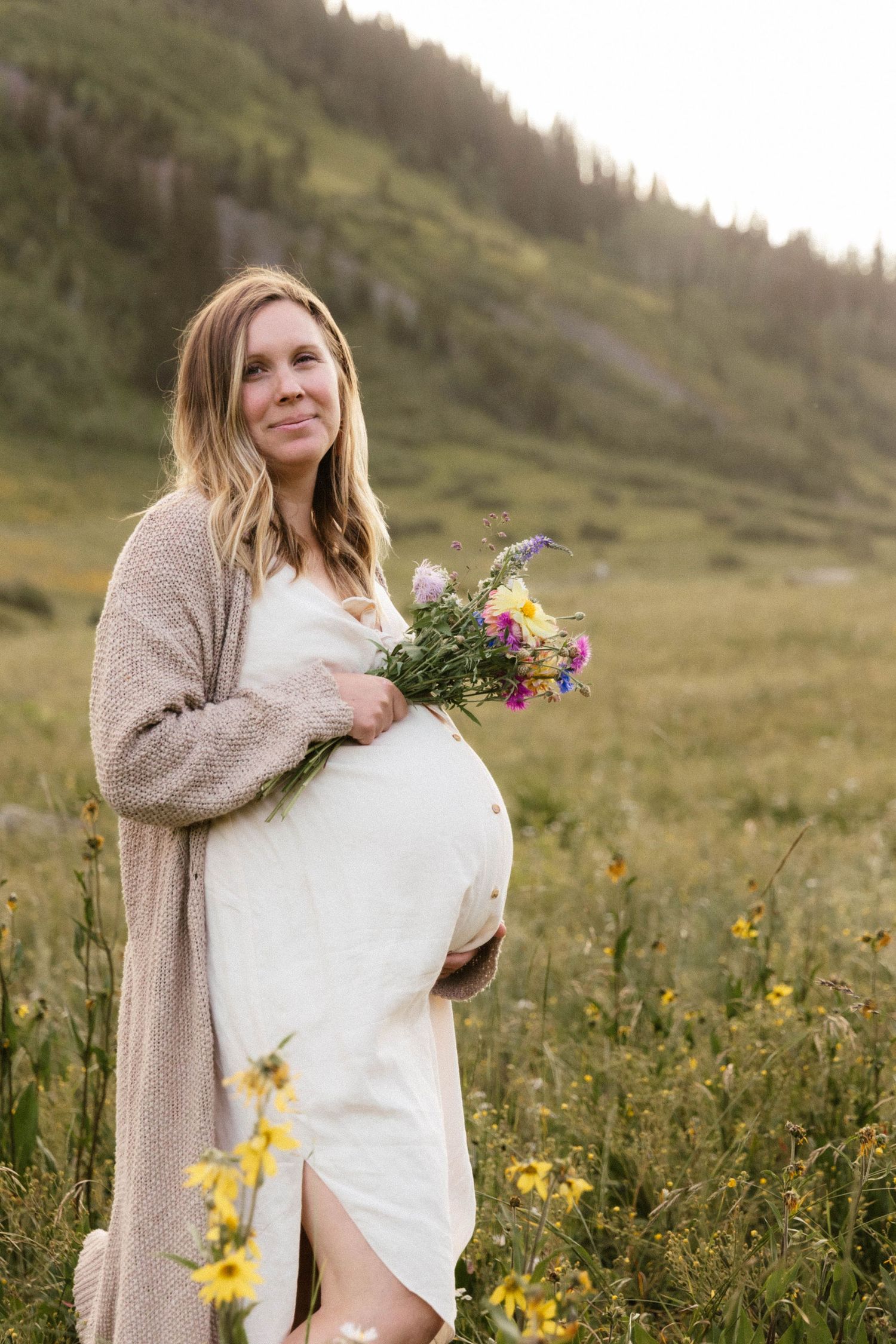 Summer maternity photo with wildflowers crested butte, Colorado