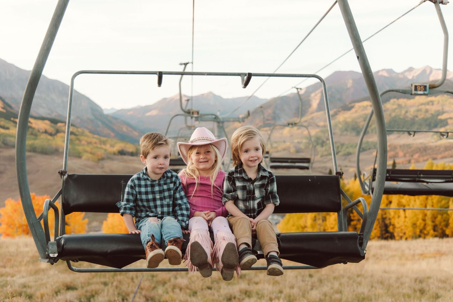 Fall family photo Crested Butte Colorado, aspens ski lift mountain view