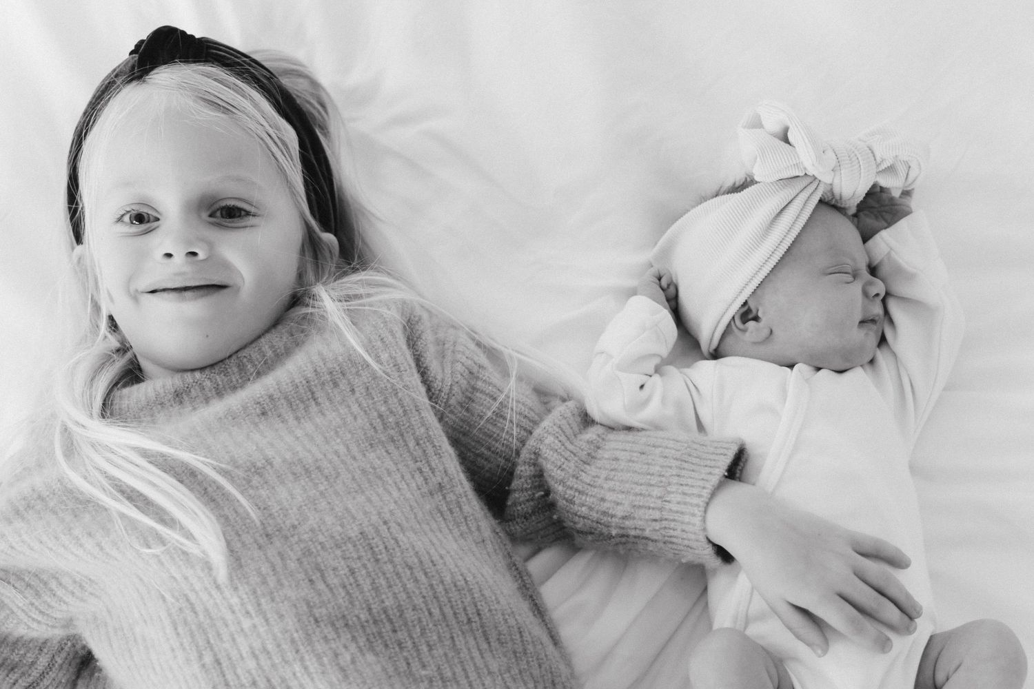 At home newborn photography on bed. Crested Butte, Colorado