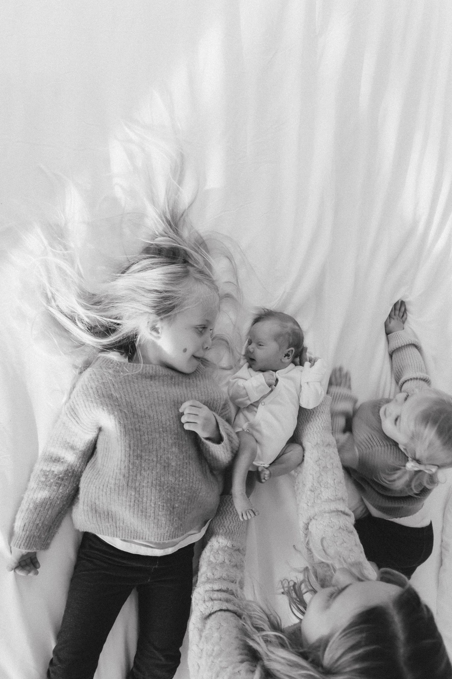 At home newborn photography on bed. Crested Butte, Colorado