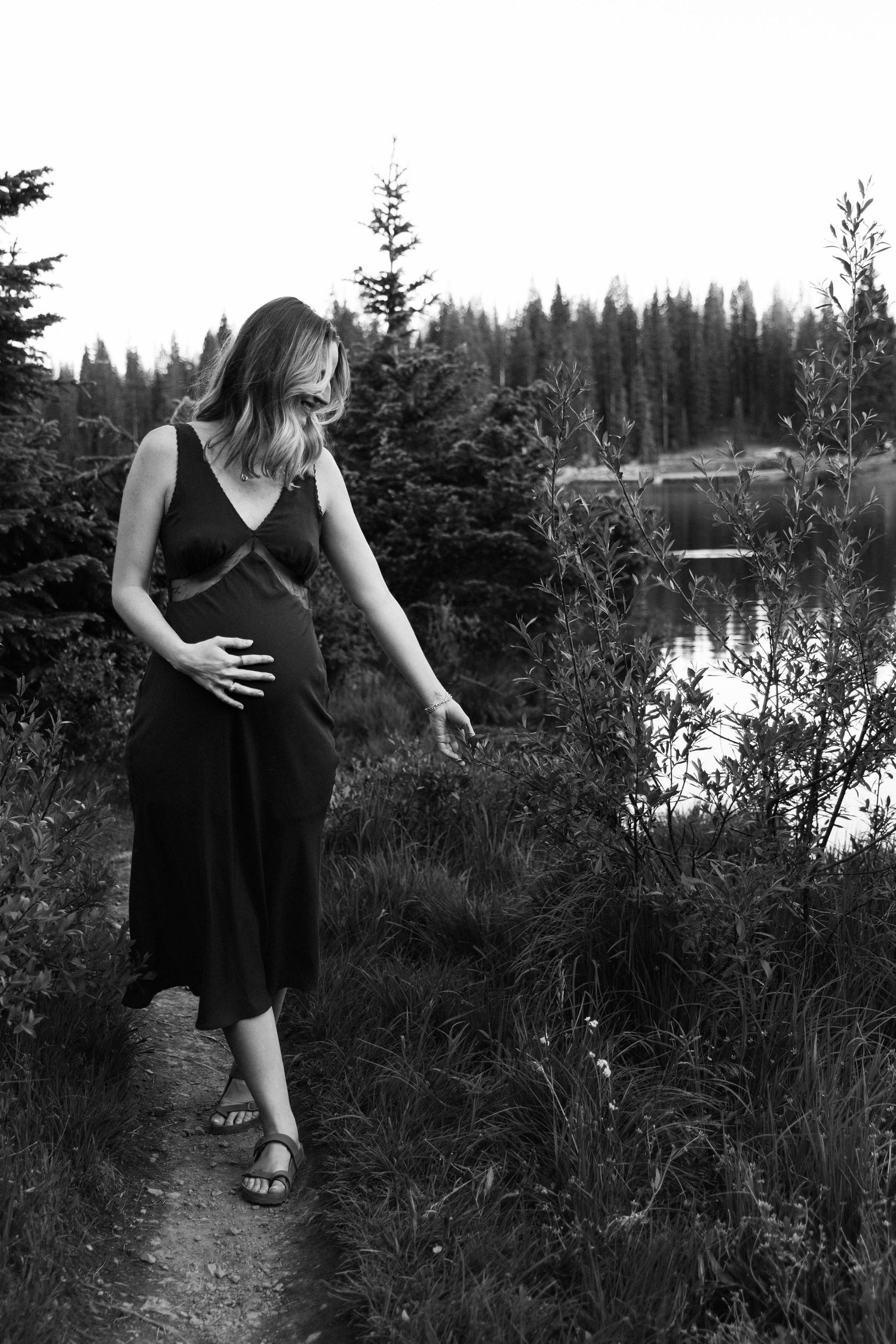 Summer maternity photo with wildflowers crested butte, Colorado Lake Irwin by lake