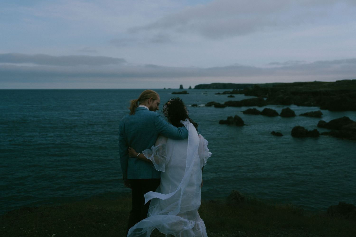 A series of moody coastal landscape photos showing rocky shores and dark waters under cloudy skies at dusk.