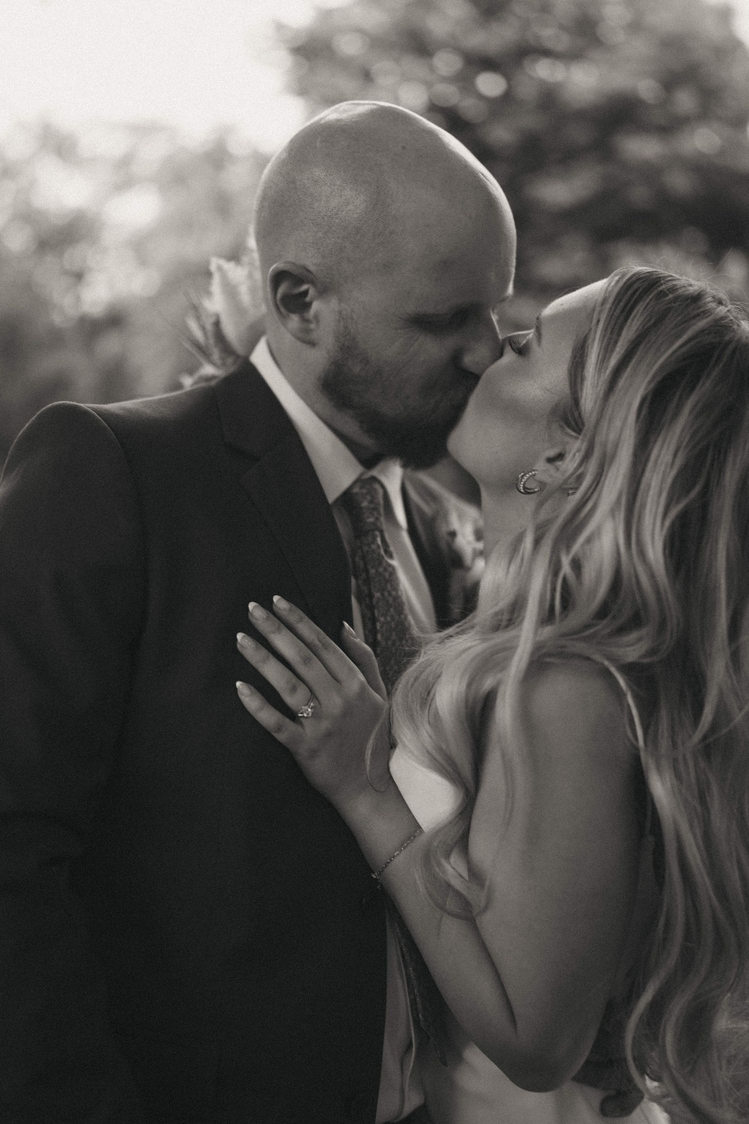 A romantic monochrome sequence of a couple sharing tender moments in black and white photography.