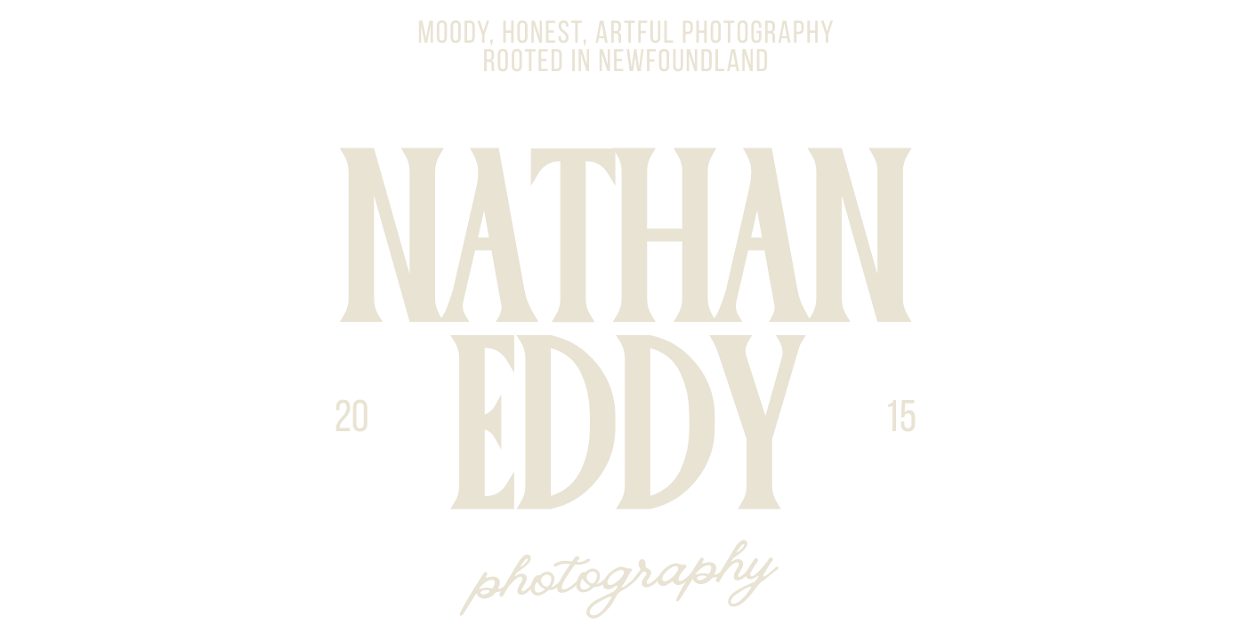 A row of faded text displaying names in a light beige or cream color against a white background.