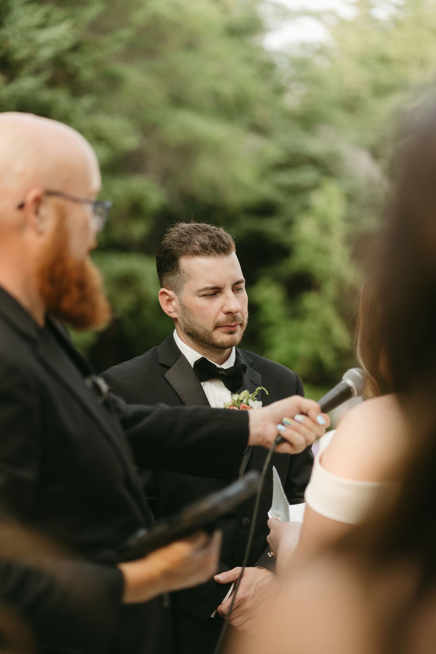 Close-up shot of wedding ceremony moments with elegant formal attire.