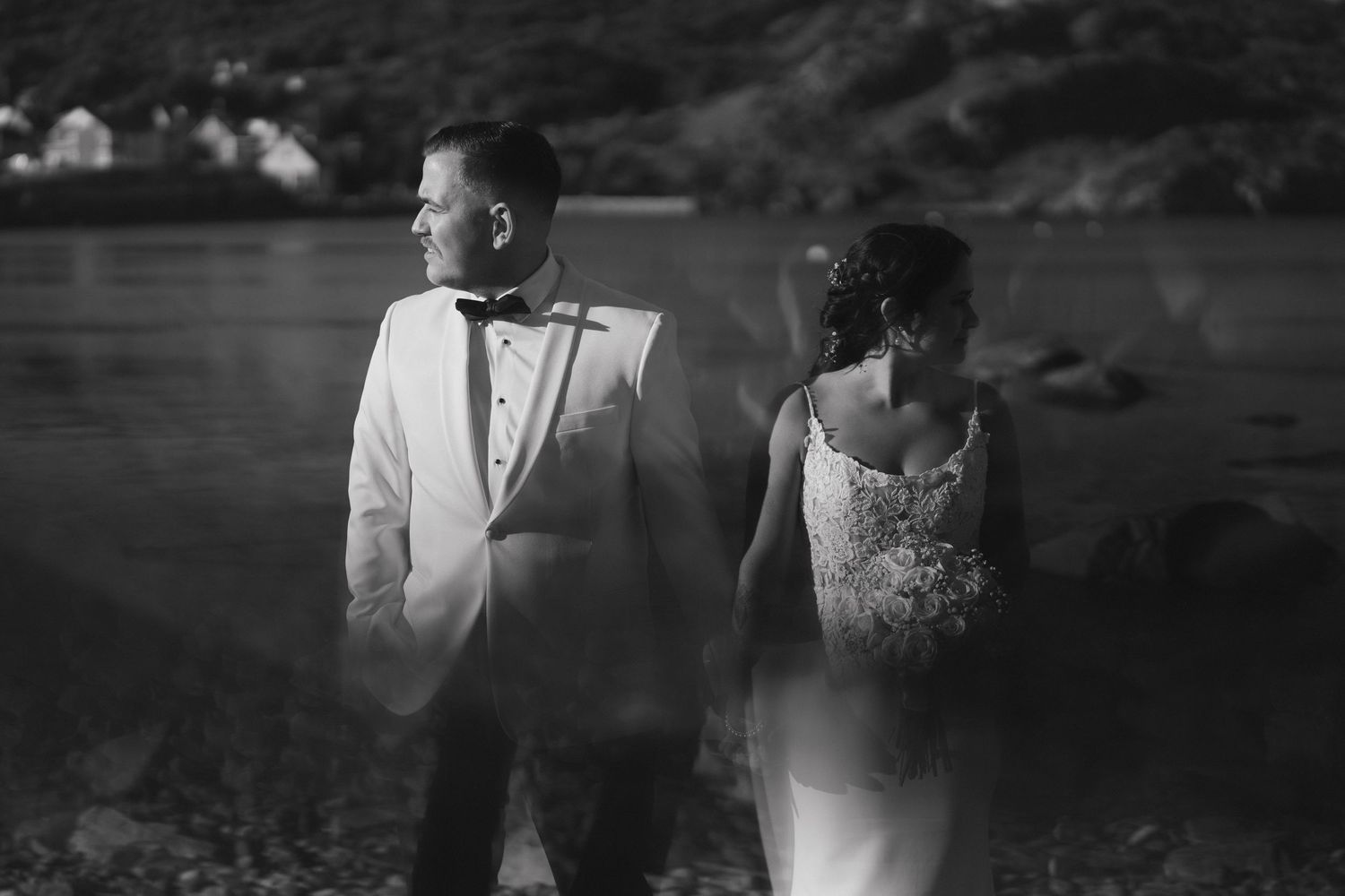 A black and white wedding photo collage showing romantic moments between a couple in formal attire.