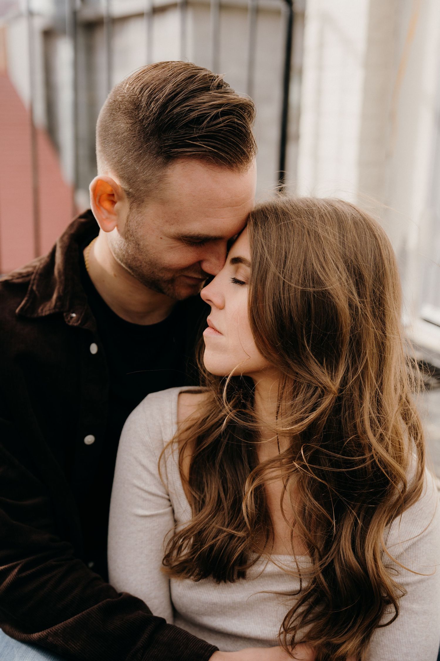 Series of intimate portraits showing couple in casual wear during romantic moments.