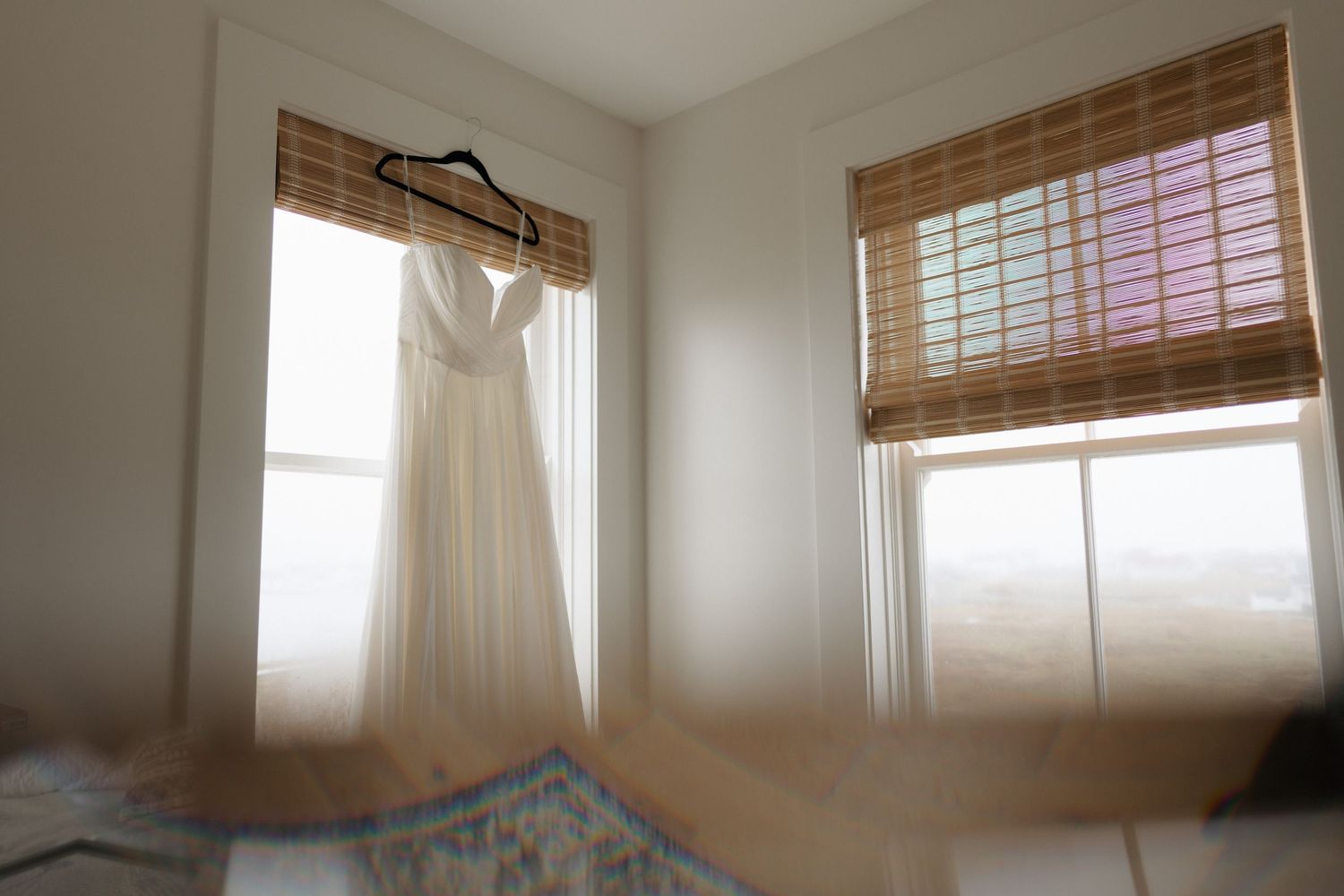 A series of four interior photos showing white walls, bamboo window shades, and natural lighting in a modern room.