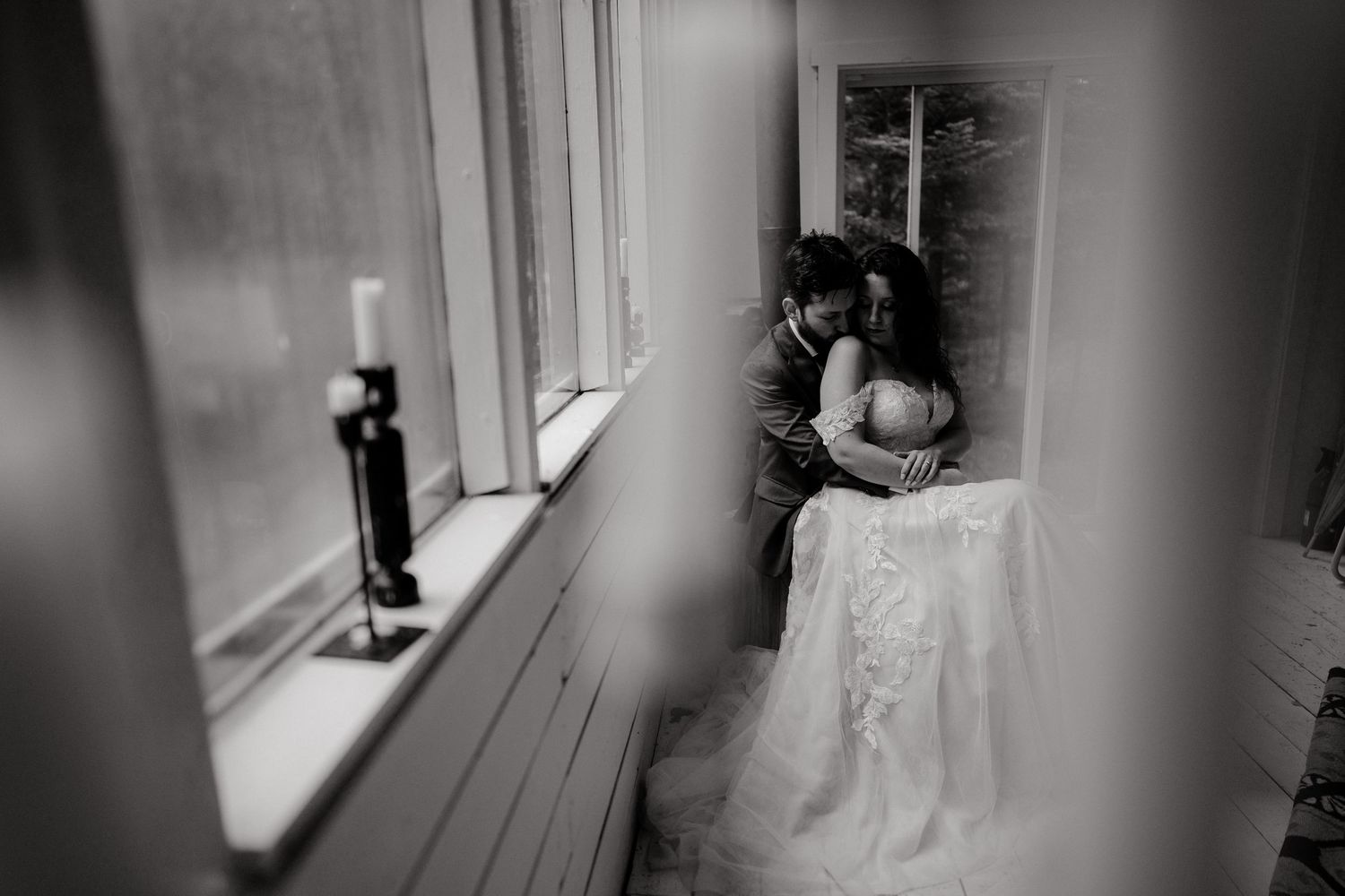 Artistic monochrome interior shot with window light and bridal details.