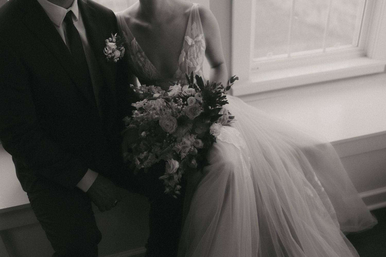 A collection of black and white wedding photography moments showing couples and bridal party members during a ceremony.
