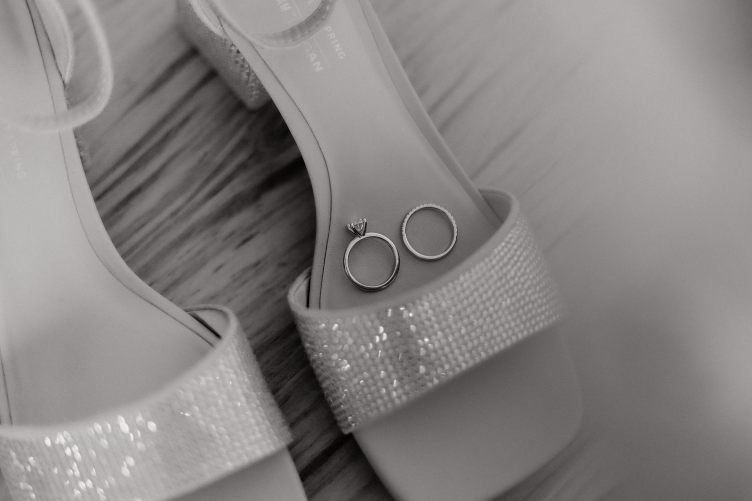 Artistic close-up of wedding accessories with sparkling details.